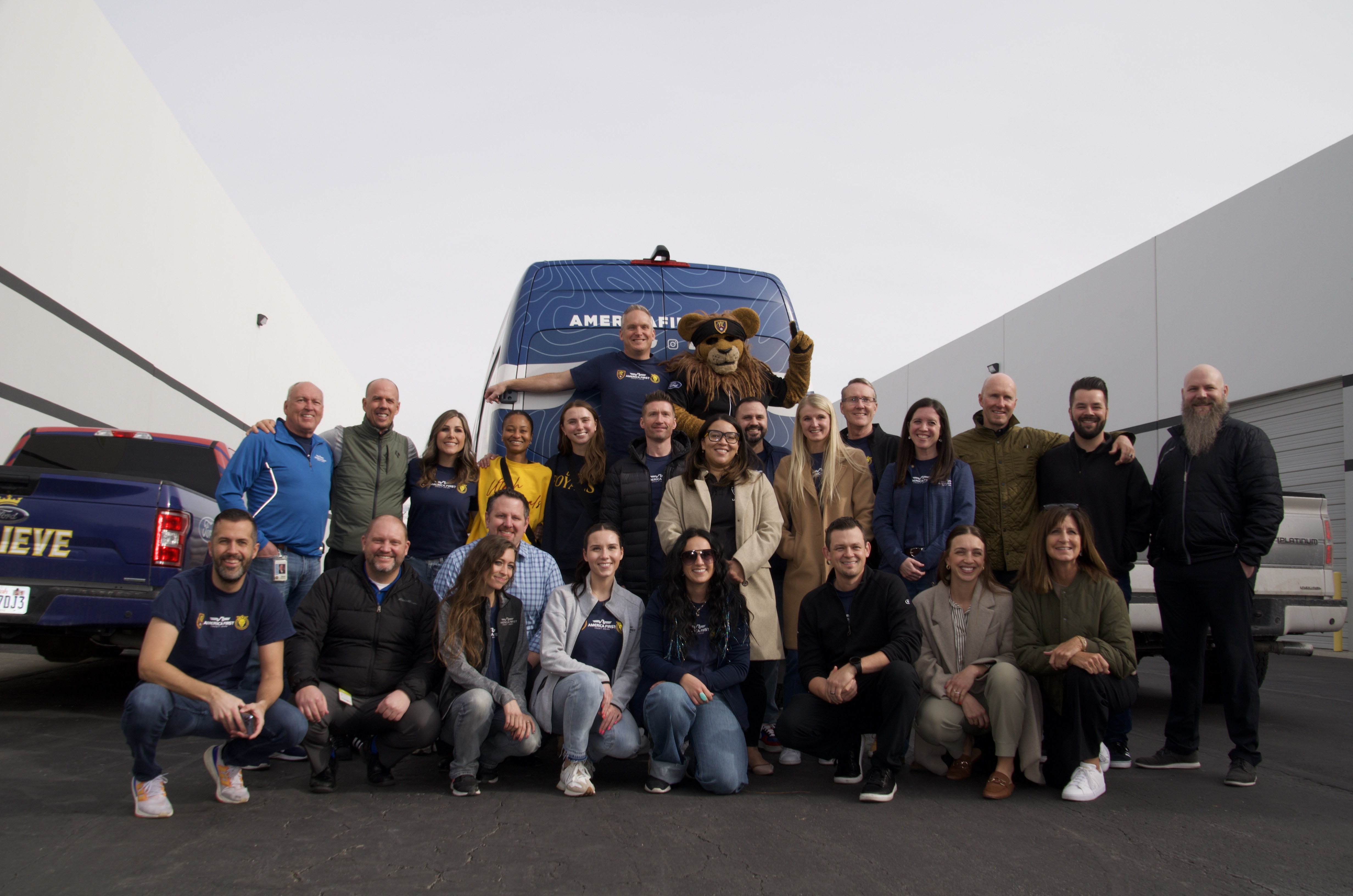 Volunteers from Real Salt Lake and America First Credit Union pose for a photo Monday in West Valley City.