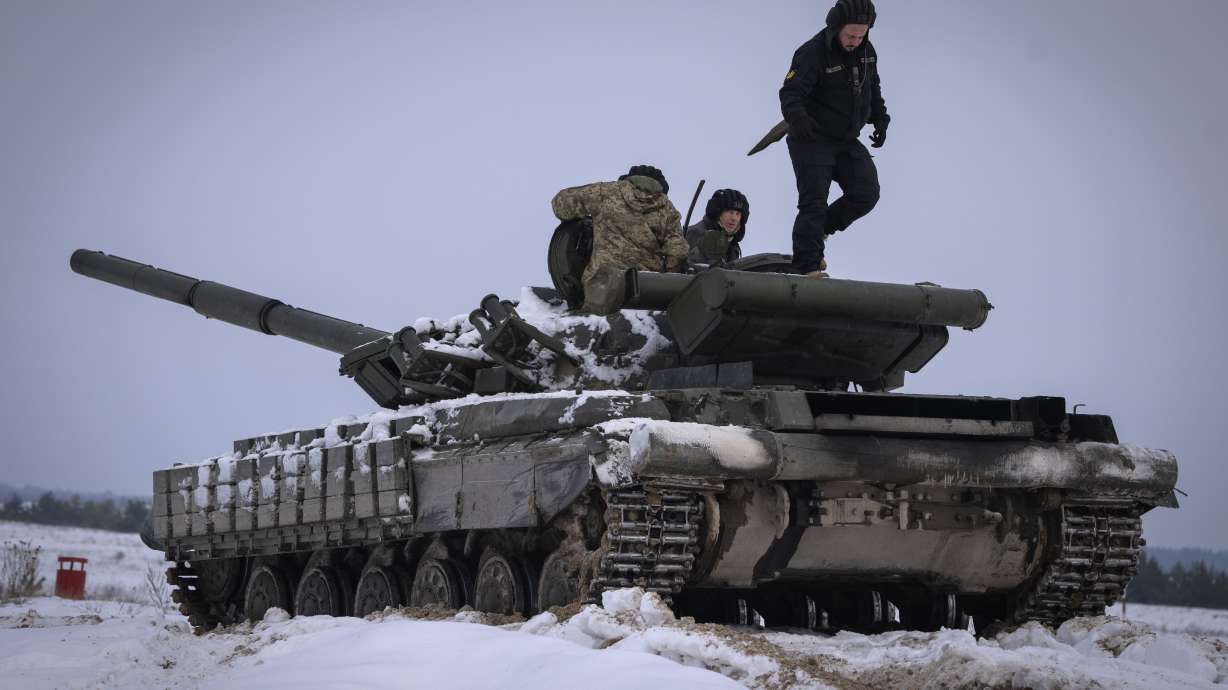 Ukrainian soldiers practice on a tank during military training in Ukraine on Dec. 6, 2023. The world has entered an era of increasing instability as countries around the globe boost military spending in response to Russia’s invasion of Ukraine, the Hamas attack on Israel and China’s growing assertiveness in the South China Sea. That’s the conclusion of a new report from the International Institute for Strategic Studies released on Tuesday.