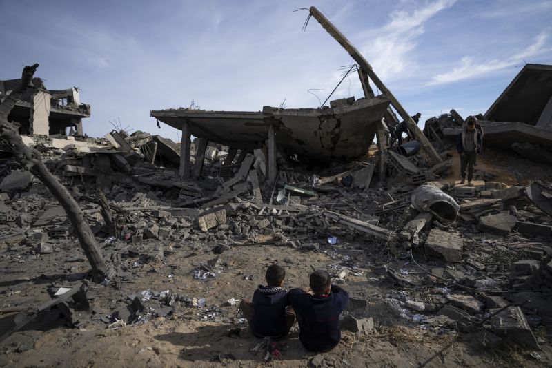 Palestinians inspect the damage to residential buildings where two Israeli hostages were reportedly held before being rescued during an operation by Israeli security forces in Rafah, southern Gaza Strip, Monday.