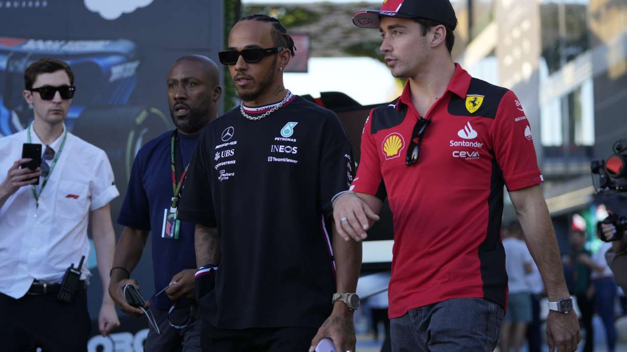 FILE - Mercedes driver Lewis Hamilton of Britain, left, and Ferrari driver Charles Leclerc of Monaco arrive to speak to media ahead of the Formula On Saudi Arabian Grand Prix in Jeddah, Saudi Arabia, Thursday, March 16, 2023. Lewis Hamilton's arrival will present “a huge opportunity” for Ferrari next year but signing the seven-time Formula One champion involved some uncomfortable phone calls, team principal Fred Vasseur said Tuesday, Feb. 13, 2024. Hamilton is joining Ferrari for next season after driving for Mercedes since 2013. He will team up with Charles Leclerc at the Italian team after Carlos Sainz Jr. leaves.
