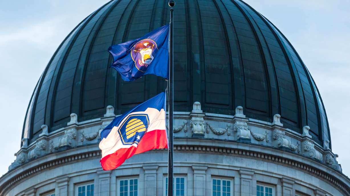 Utah's soon-to-be historical and new state flags fly above the Utah Capitol on Monday. An initiative seeking to pause the new state flag's implementation officially failed Thursday, but the fight over the issue might not be over.