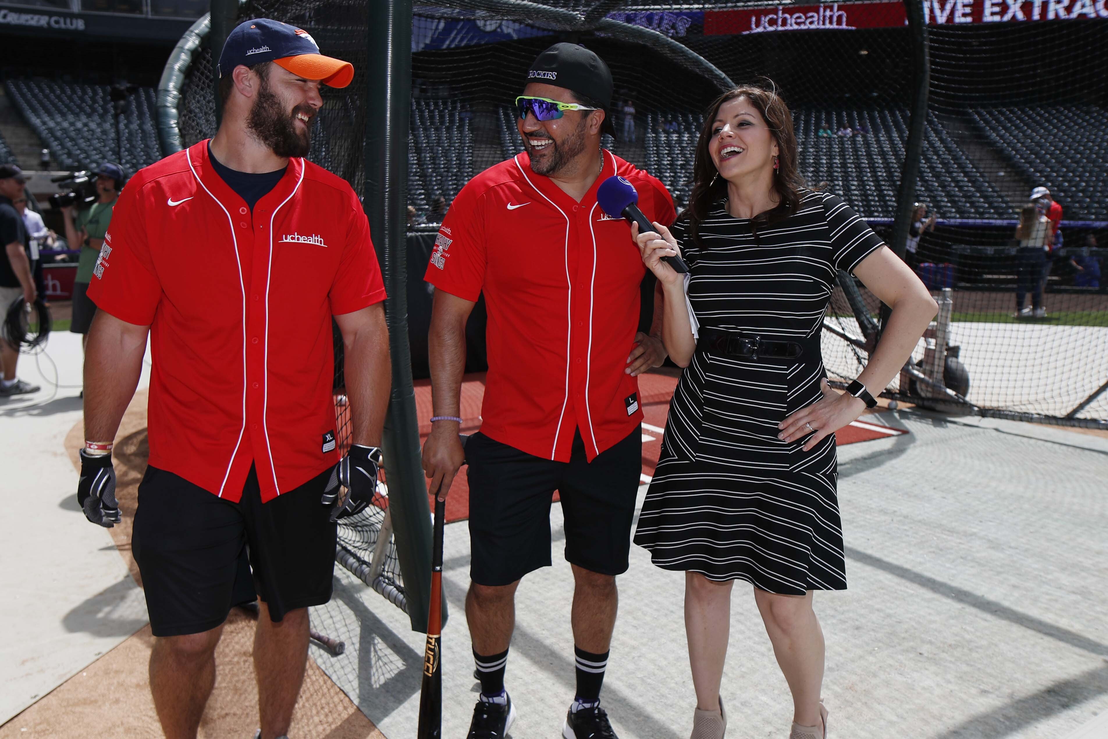 FILE - Colorado Rockies television announcer Jenny Cavnar, right, jokes with Vinny Castilla, center, special assistant to the Rockies general manager, and Denver Broncos fullback Andy Janovich, June 11, 2019, in Denver. Cavnar is the new primary play-by-play announcer for the Oakland Athletics, hired by NBC Sports California. The company made the announcement Tuesday, Feb. 13, 2024.