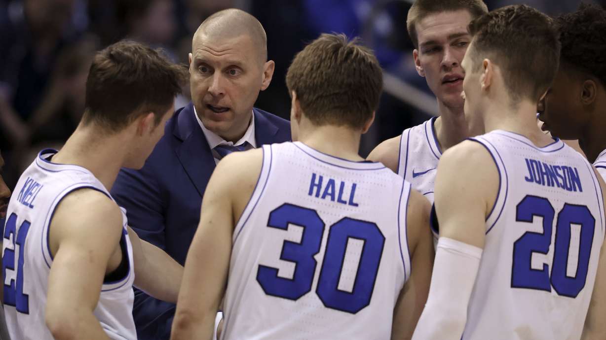 BYU head coach Mark Pope instructs his team during a timeout against the UCF Knights at the Marriott Center in Provo on Tuesday, Feb. 13, 2024.