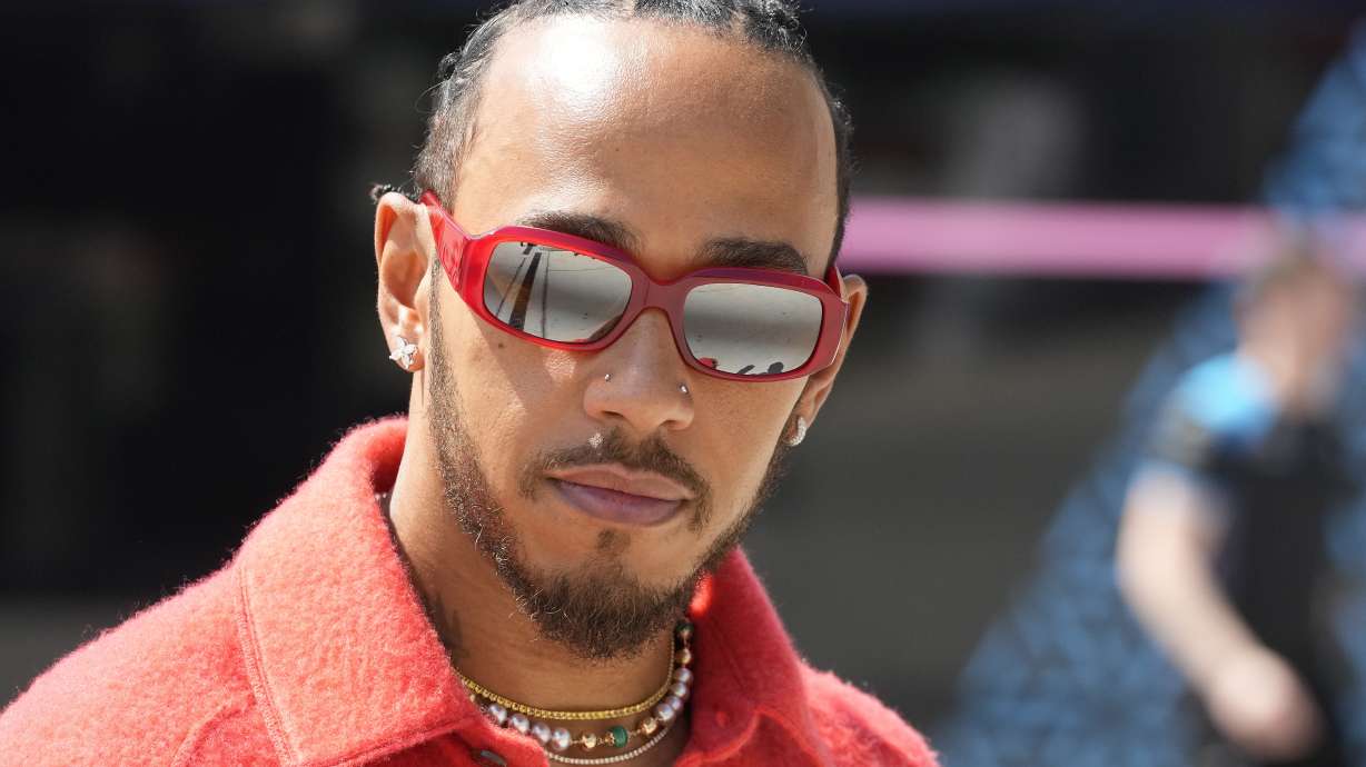FILE - Mercedes driver Lewis Hamilton of Britain arrives at the Bahrain International Circuit in Sakhir, Bahrain, Thursday, March 2, 2023. Lewis Hamilton's arrival will present “a huge opportunity” for Ferrari next year but signing the seven-time Formula One champion involved some uncomfortable phone calls, team principal Fred Vasseur said Tuesday, Feb. 13, 2024.