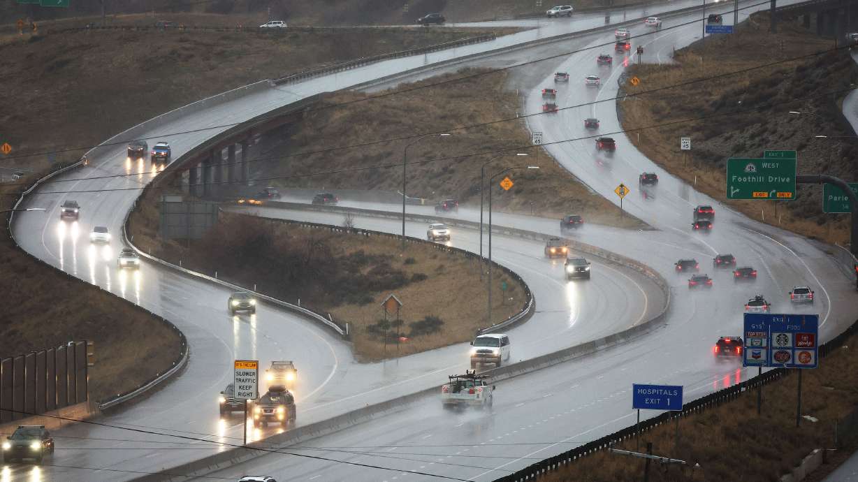 Motorists drive in the rain in Millcreek on Feb. 7. Mountain snow and valley rain are back in Utah's forecast Wednesday to close out the workweek after a short lull.