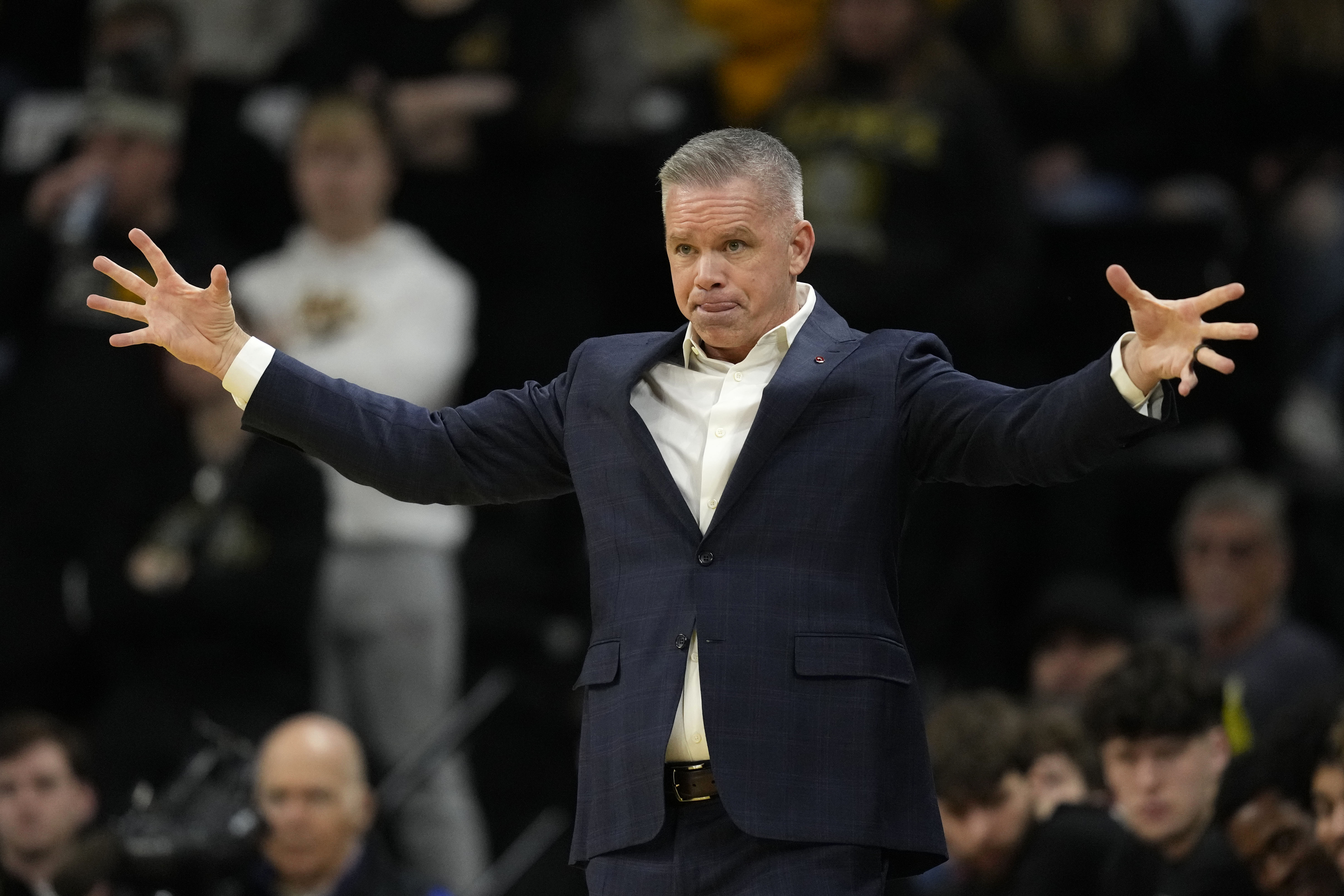 Ohio State head coach Chris Holtmann directs his team during the first half of an NCAA college basketball game against Iowa, Friday, Feb. 2, 2024, in Iowa City, Iowa.