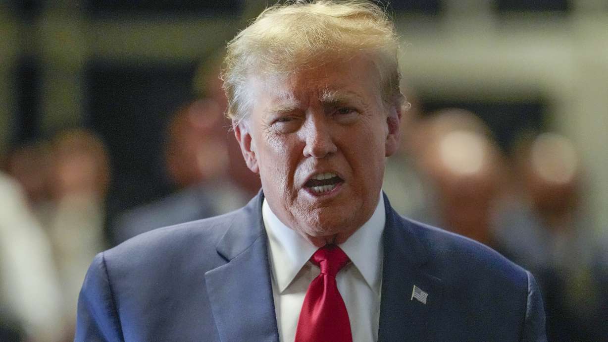 Former President Donald Trump arrives at Manhattan criminal court, Thursday in New York. A judge denied Trump's request to dismiss criminal charges stemming from hush money paid to a porn star.