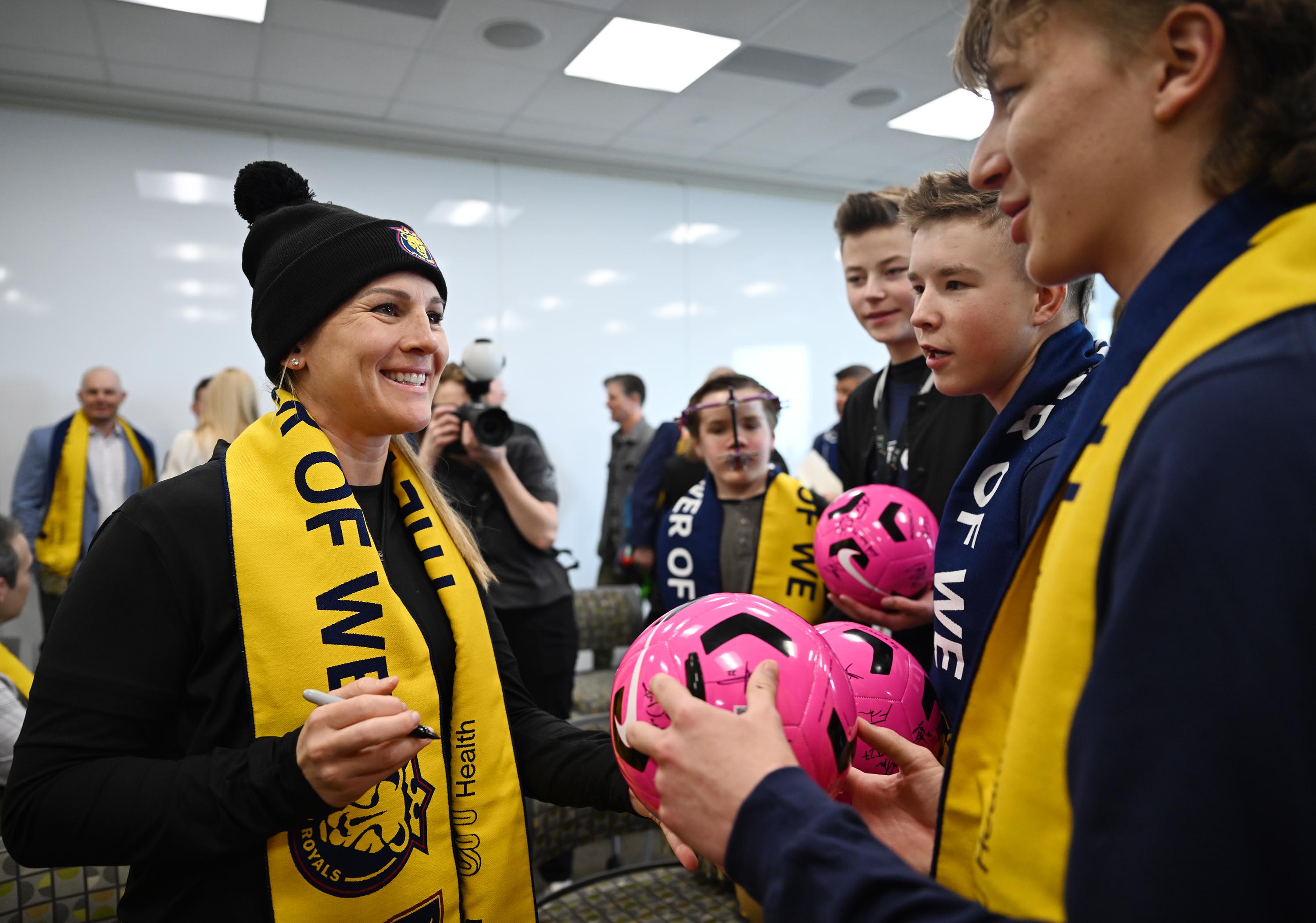 Utah Royals Head Coach Amy Rodriguez talks with members of the Youth Advisory Council after Real Salt Lake and the Utah Royals announced a long-term partnership with Intermountain Health and Select Health during a press event at Primary Children’s Hospital on Wednesday.