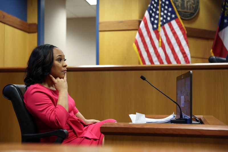 Attorney Fani Willis takes the stand as a witness during a hearing in the case of State of Georgia v. Donald John Trump at the Fulton County Courthouse in Atlanta, Ga., Thursday.