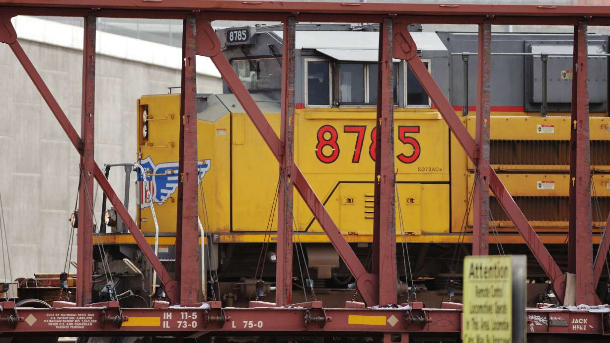 An engine pulls cars at the Union Pacific Roper yard in South Salt Lake on Feb. 22, 2022. Industries making investments in energy infrastructure to expand under a proposal that received endorsement from a legislative committee on Thursday.