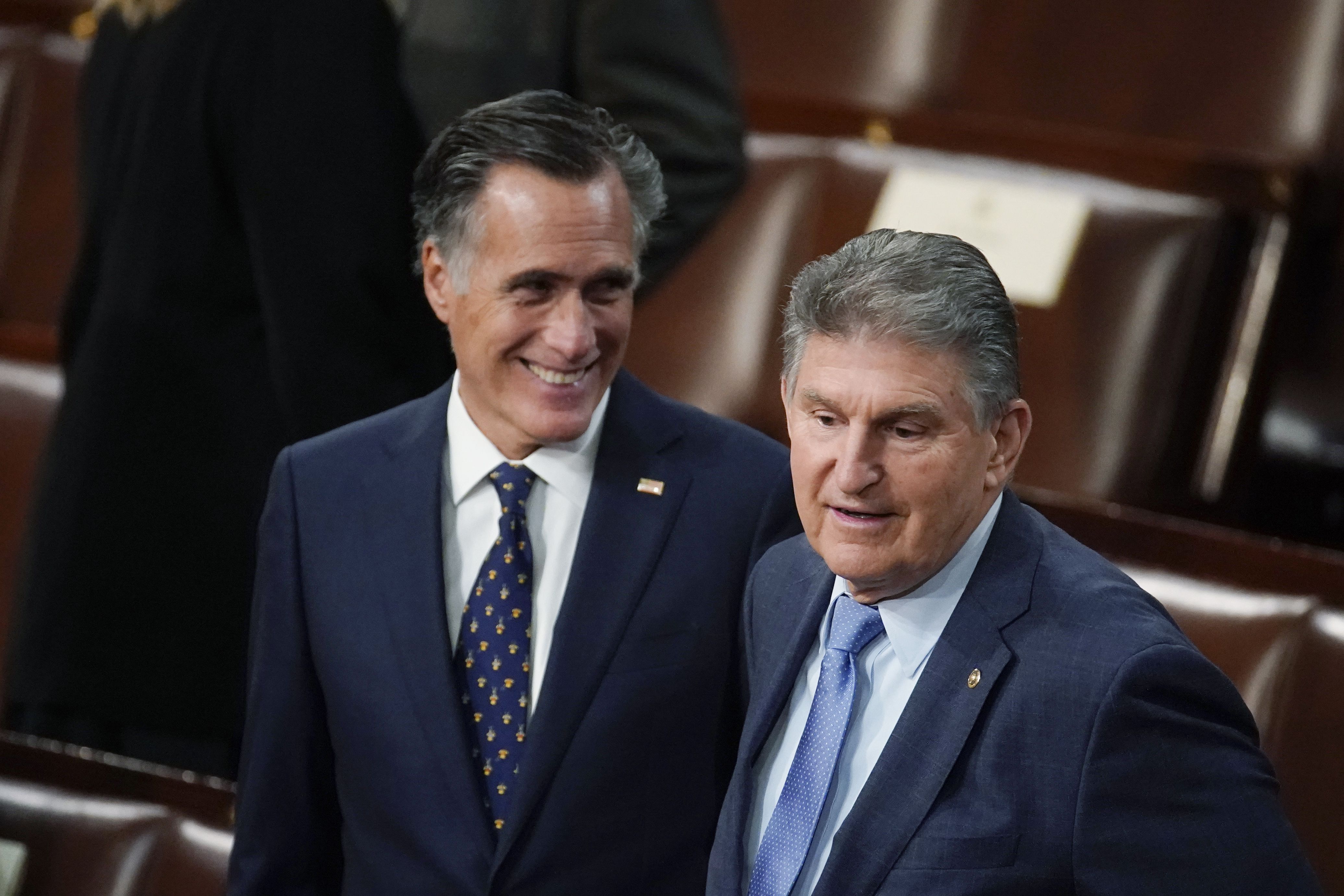Sen. Joe Manchin, D-W.Va., right, and Sen. Mitt Romney, R- Utah, arrive at President Joe Biden’s State of the Union address on March 1, 2022, in Washington. Romney is "not going to run for president" in 2024, he reiterated Thursday.