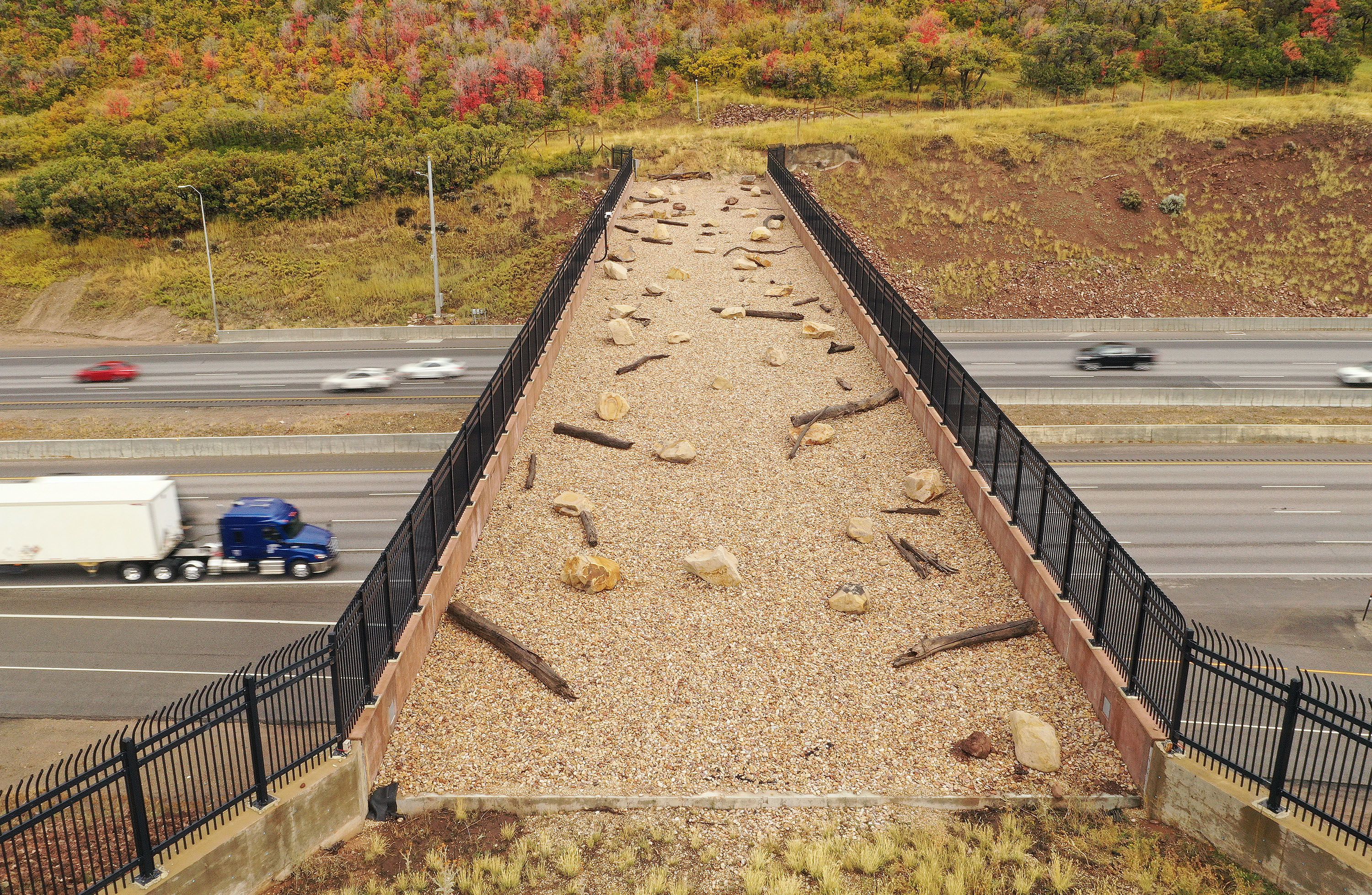 Motorists travel under a wildlife crossing bridge spanning I-80 in Parleys Canyon on Oct. 3, 2023. The 14th annual Conservation in the West poll shows voters are concerned about threats to the environment.