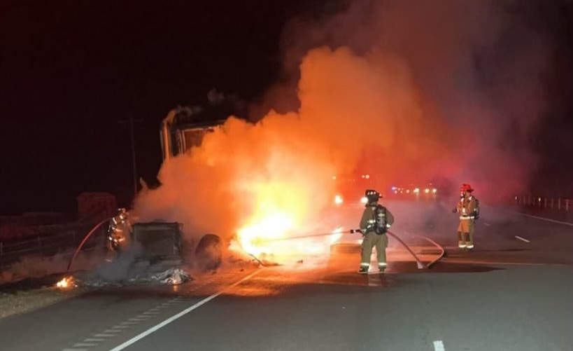 Hurricane Valley Fire and Rescue firefighters extinguish the flames after a tractor-trailer caught fire, Leeds, Washington County, Thursday.