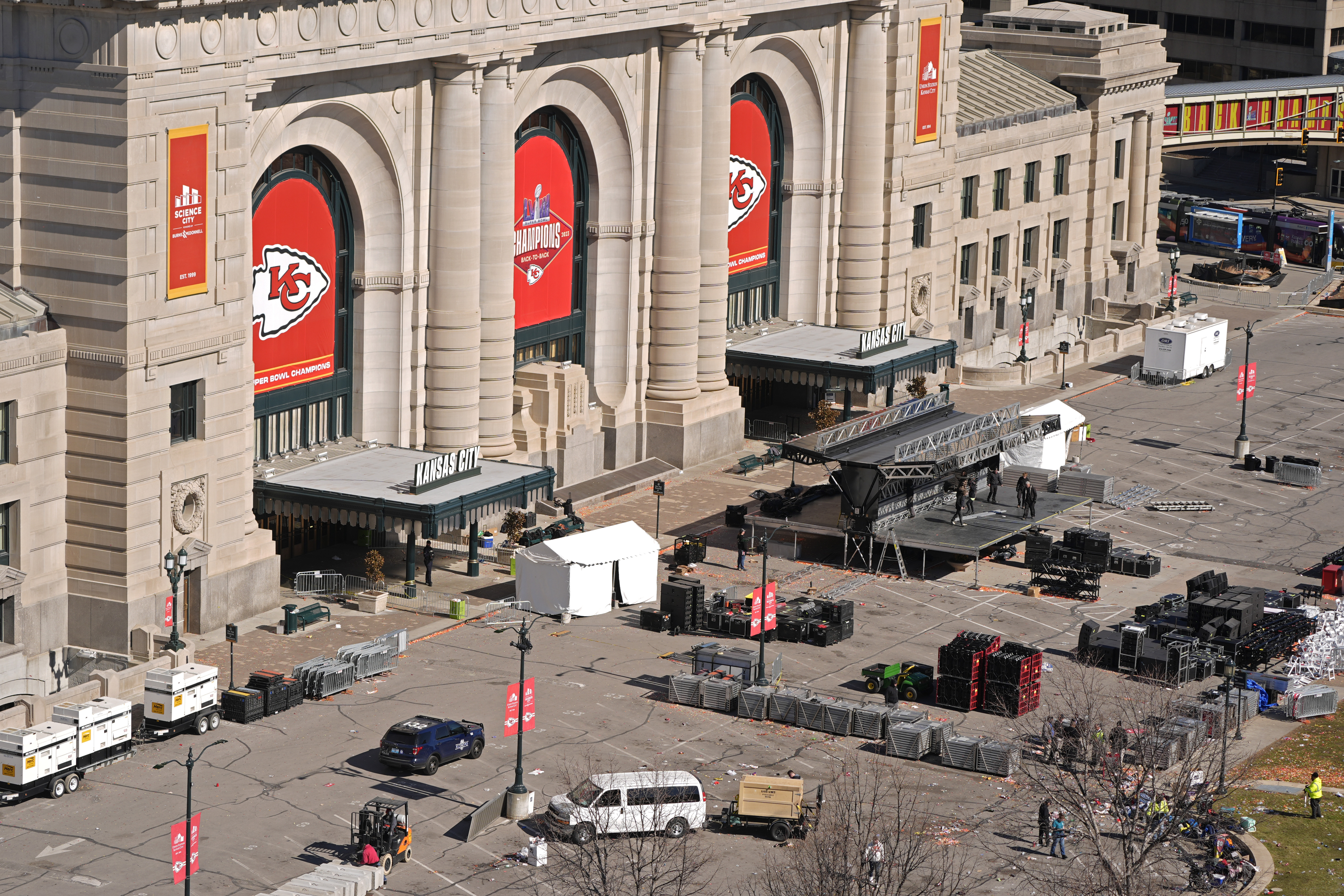 Workers dismantle the stage outside of Union Station Thursday, in Kansas City, Mo. The venue was the site of a mass shooting Wednesday after a rally celebrating the Kansas City Chiefs winning the Super Bowl.