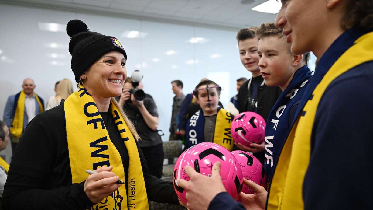 Utah Royals Head Coach Amy Rodriguez talks with members of the Youth Advisory Council after Real Salt Lake and the Utah Royals announced a long-term partnership with Intermountain Health and Select Health during a press event at Primary Children’s Hospital on Wednesday.