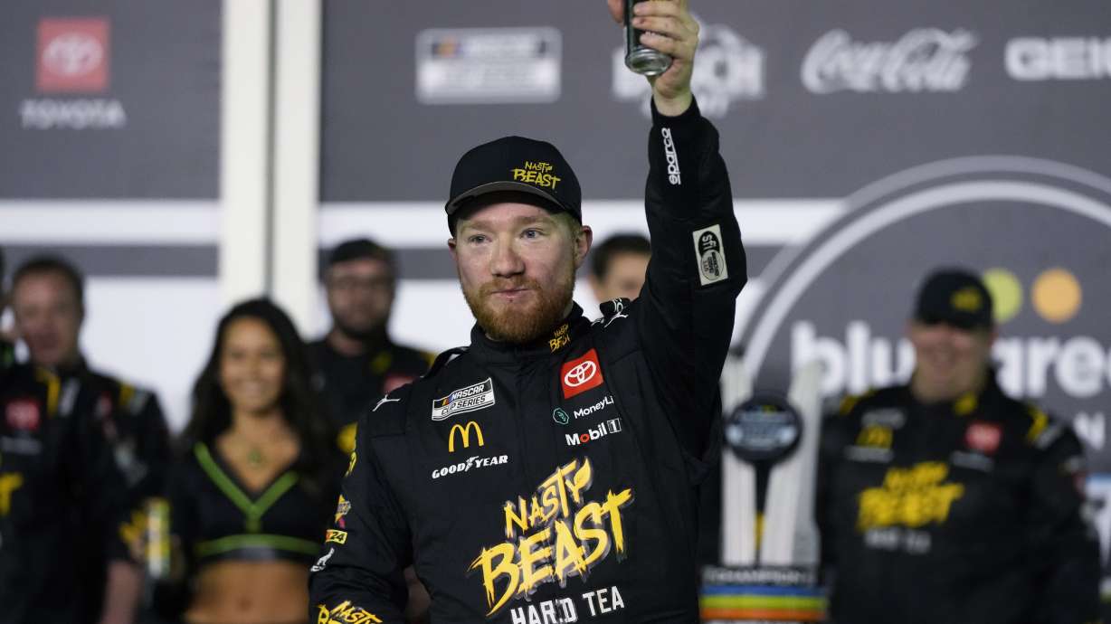 Tyler Reddick celebrates in Victory Lane after winning the first of two NASCAR Daytona 500 qualifying auto races at Daytona International Speedway, Thursday, Feb. 15, 2024, in Daytona Beach, Fla.
