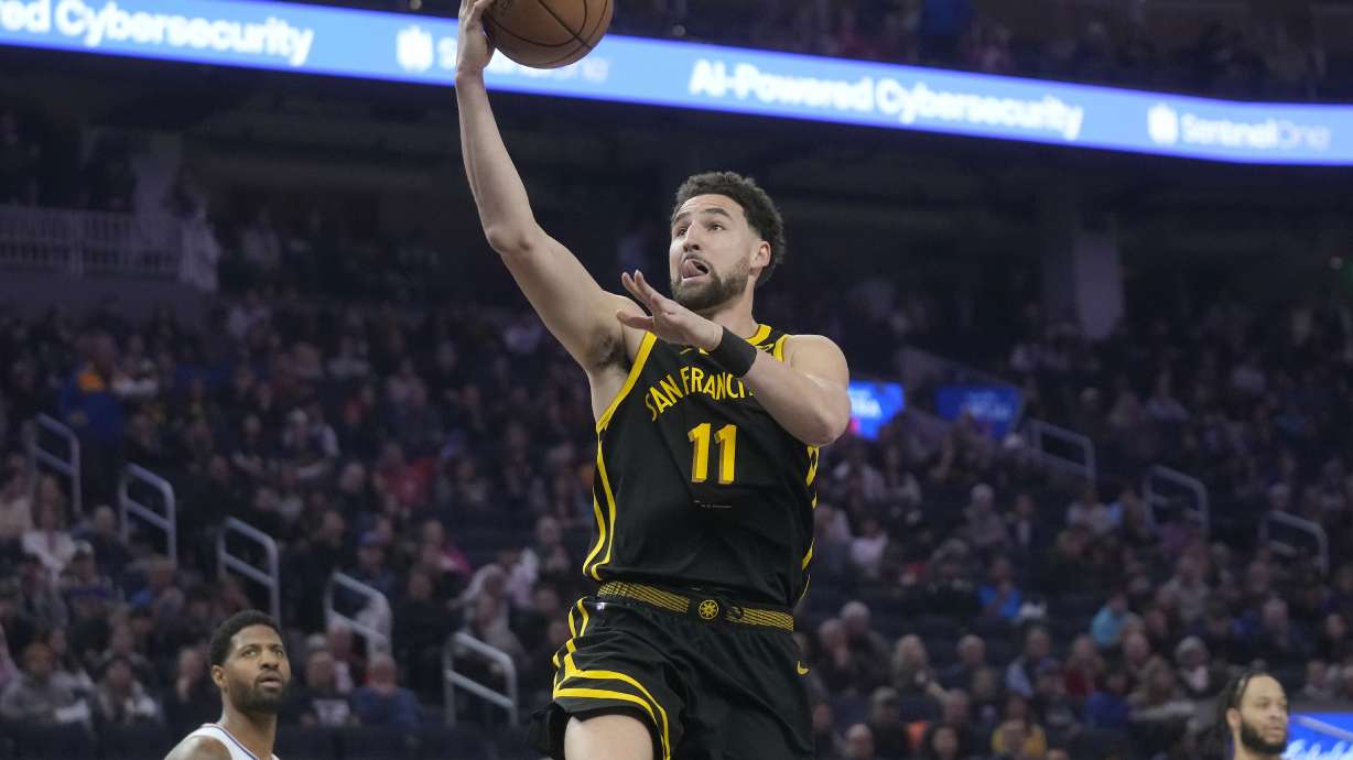 Golden State Warriors guard Klay Thompson (11) shoots against the Los Angeles Clippers during the first half of an NBA basketball game in San Francisco, Wednesday, Feb. 14, 2024.