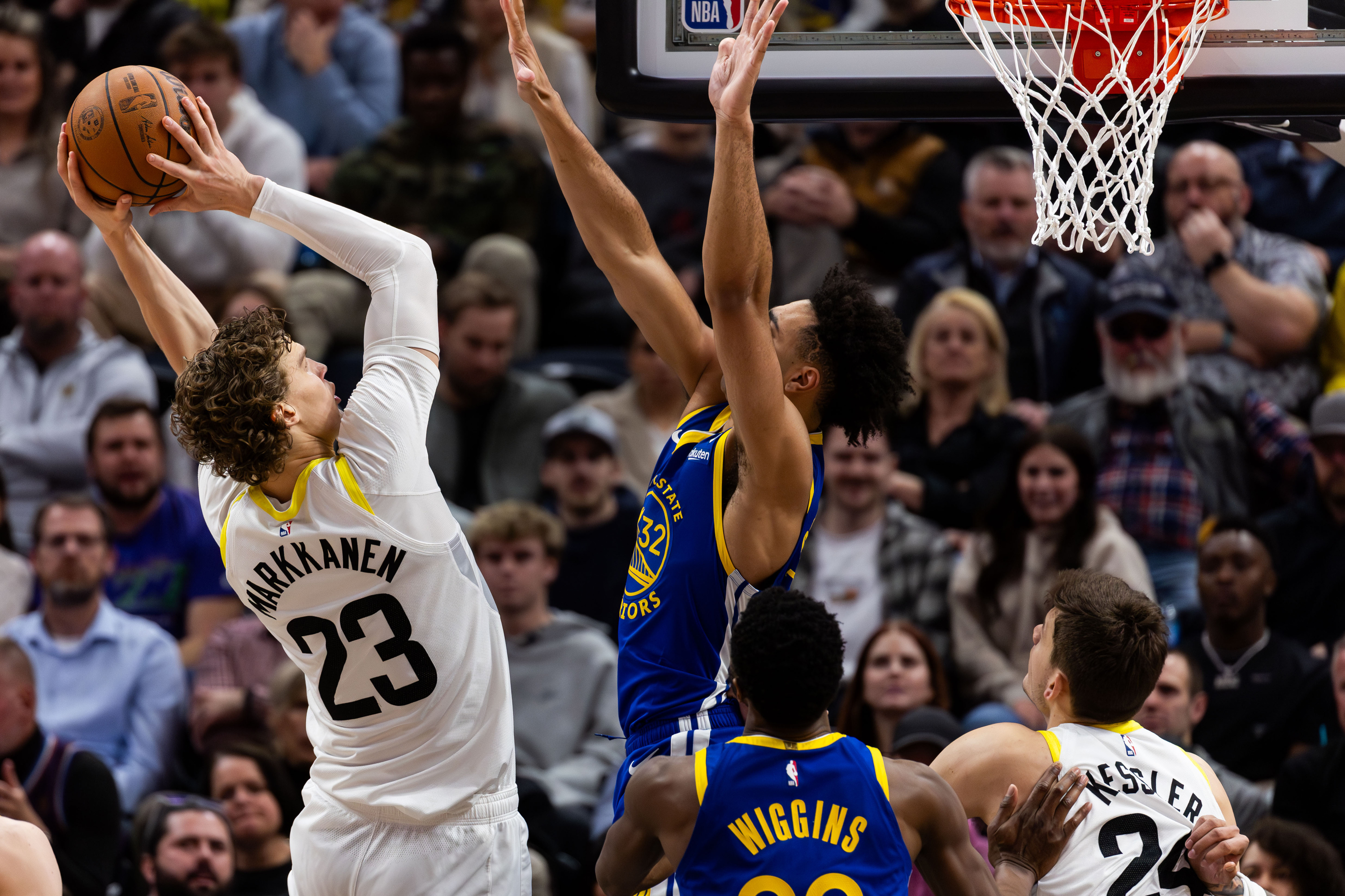 Utah Jazz forward Lauri Markkanen (23) shoots the ball with Golden State Warriors forward Trayce Jackson-Davis (32) on defense during the NBA basketball game between the Utah Jazz and the Golden State Warriors at the Delta Center in Salt Lake City on Thursday, Feb. 15, 2024.