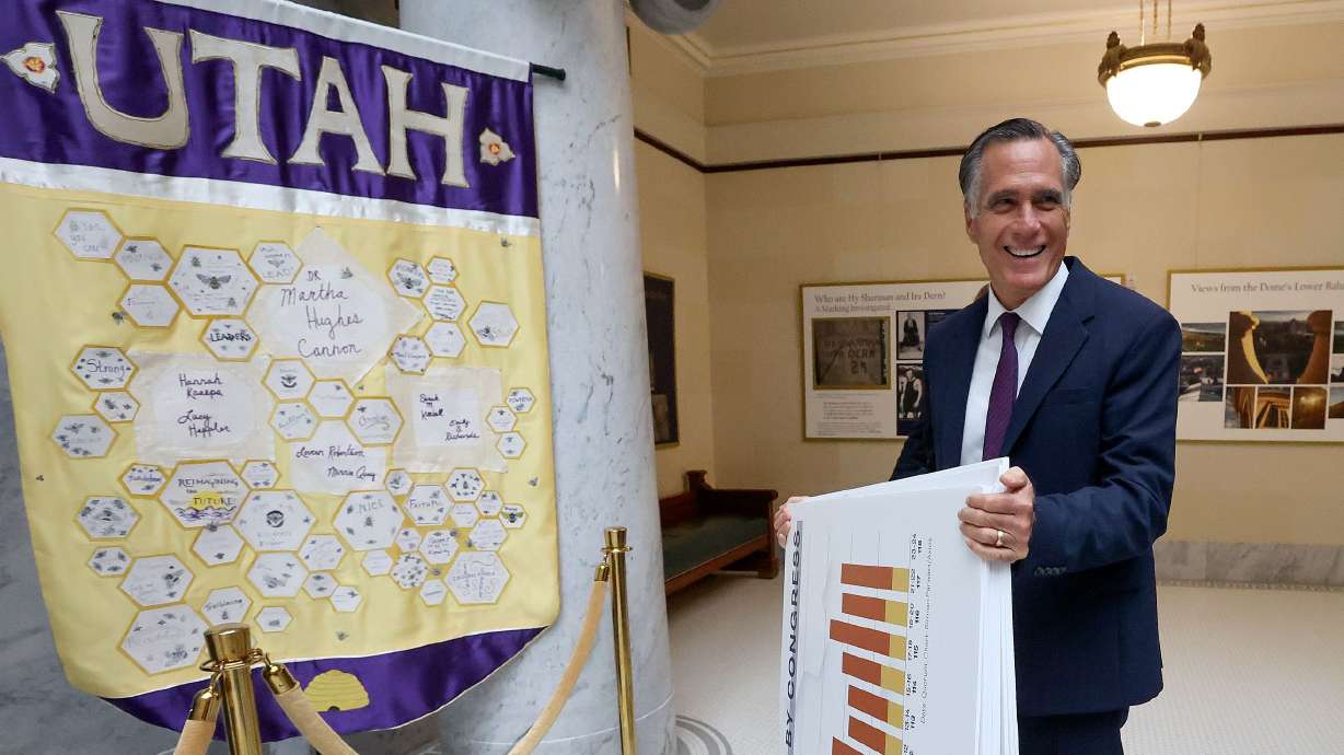 Sen. Mitt Romney, R-Utah, walks through the Capitol on his way to a Senate Majority caucus meeting in Salt Lake City on Thursday. Romney decried the lack of productivity in Washington and defended President Joe Biden against claims he is not mentally fit for office.