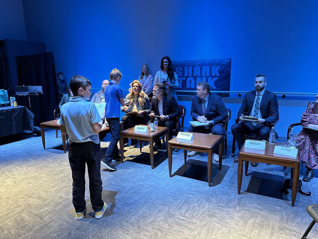 Franklin Discovery Academy students enter the shark tank to present their product idea to local business owners during a "Shark Tank" entrepreneurial experience on Wednesday.