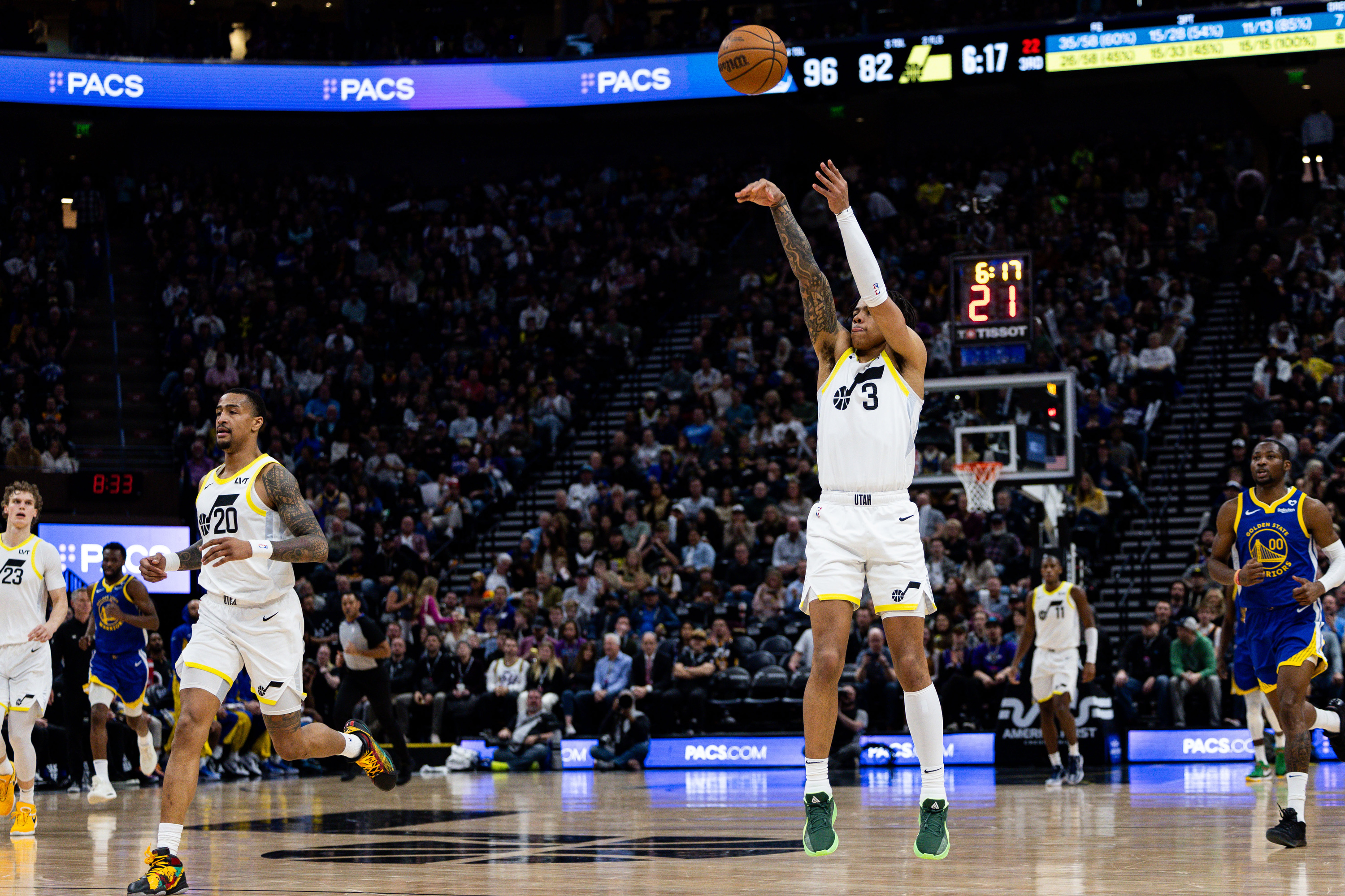 Utah Jazz guard Keyonte George (3) shoots a 3-point basket during the NBA basketball game between the Utah Jazz and the Golden State Warriors at the Delta Center in Salt Lake City on Thursday, Feb. 15, 2024.