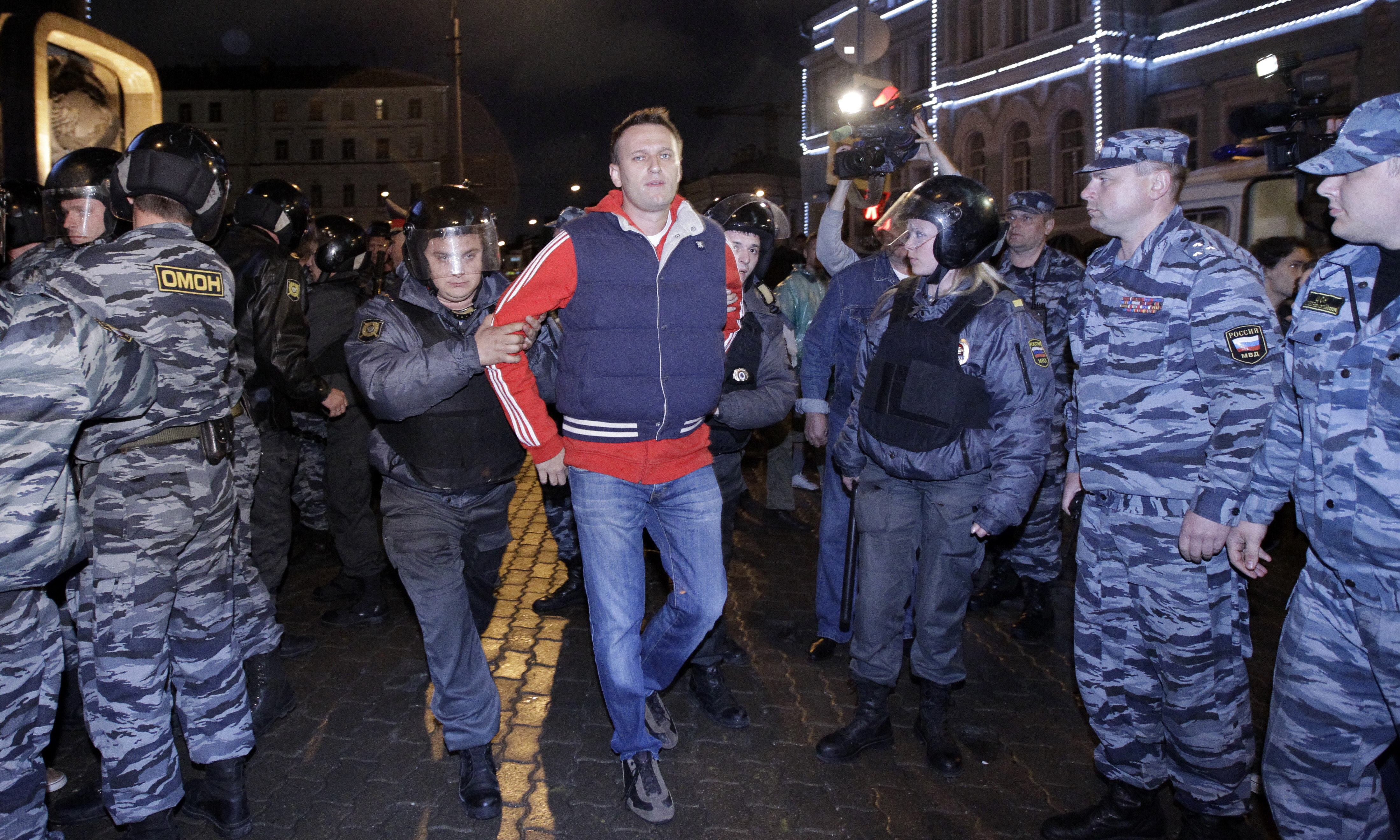 Police detain Alexei Navalny, a prominent anti-corruption whistleblower and blogger during protests in Moscow, May 8, 2012, a day after Russian President Vladimir Putin's inauguration. Russian authorities on Friday say Navalny died in prison. He was 47.