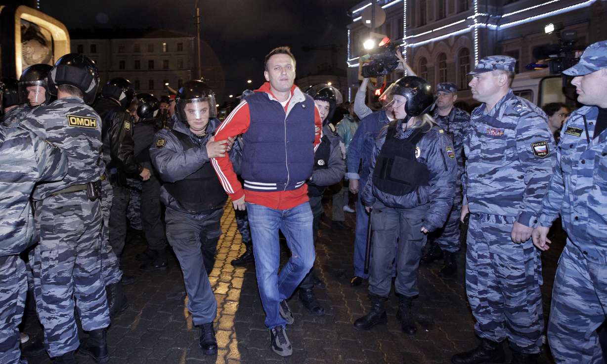 Police detain Alexei Navalny, a prominent anti-corruption whistleblower and blogger during protests in Moscow, May 8, 2012, a day after Russian President Vladimir Putin's inauguration. Russian authorities on Friday say Navalny died in prison. He was 47.