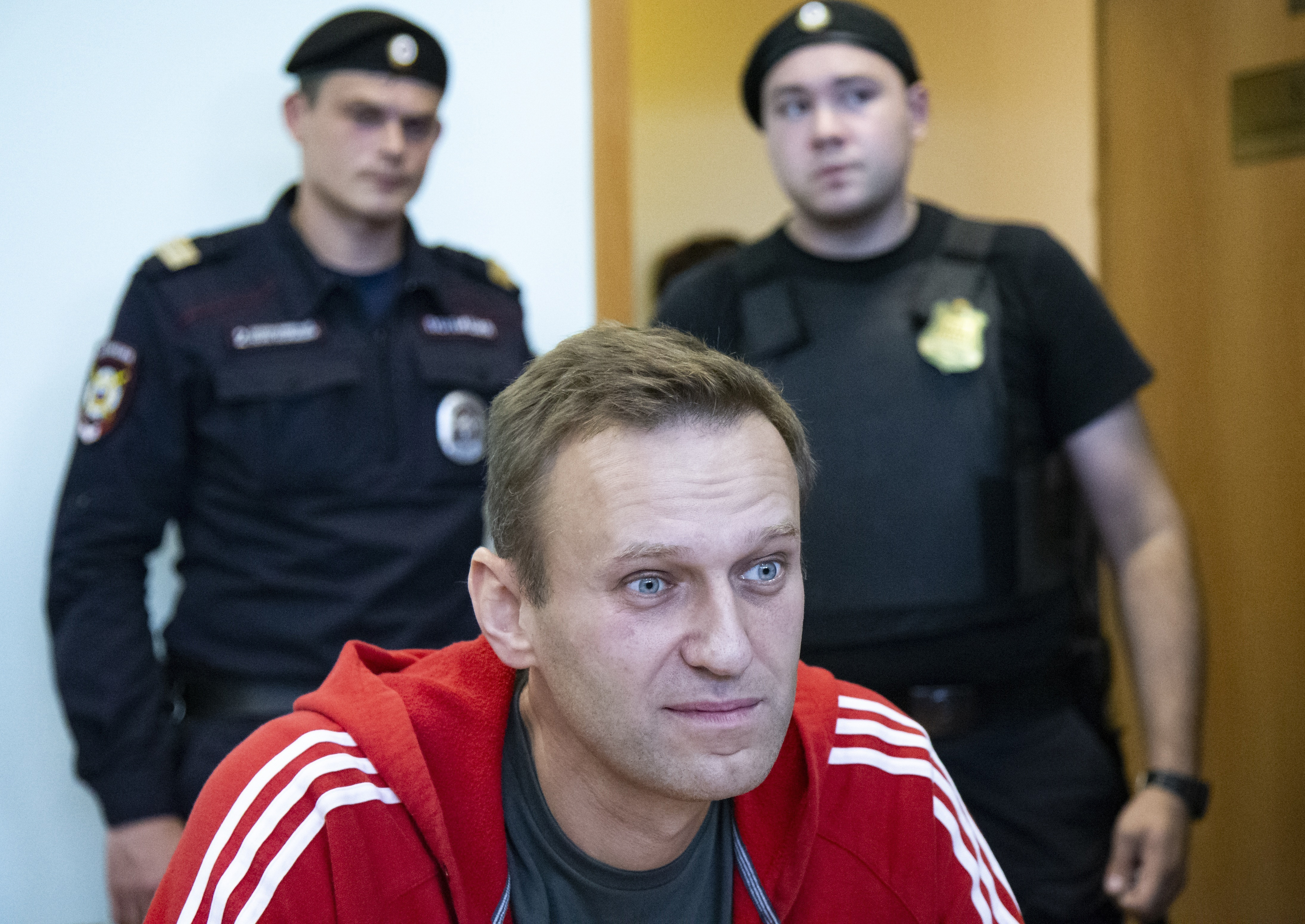 Russian opposition leader Alexei Navalny speaks to the media prior to a court session in Moscow, on Aug. 22, 2019. Navalny died in prison Friday. He was 47.