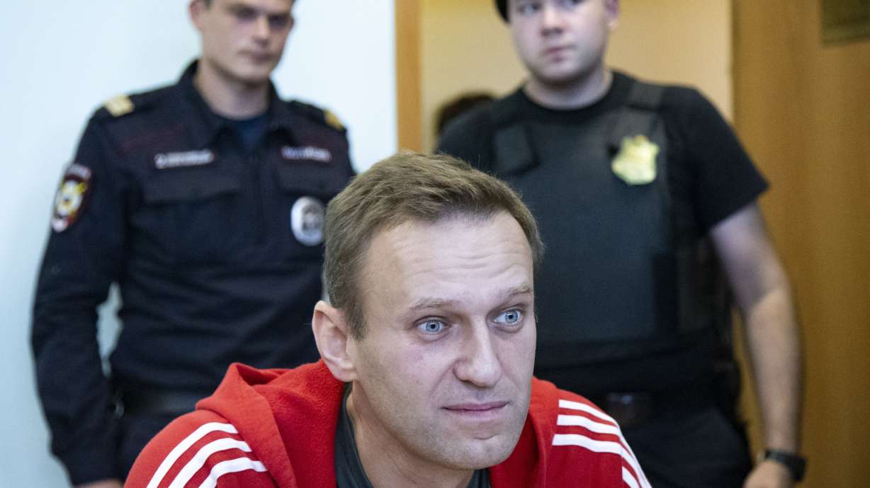 Russian opposition leader Alexei Navalny speaks to the media prior to a court session in Moscow, on Aug. 22, 2019. Navalny died in prison Friday. He was 47.