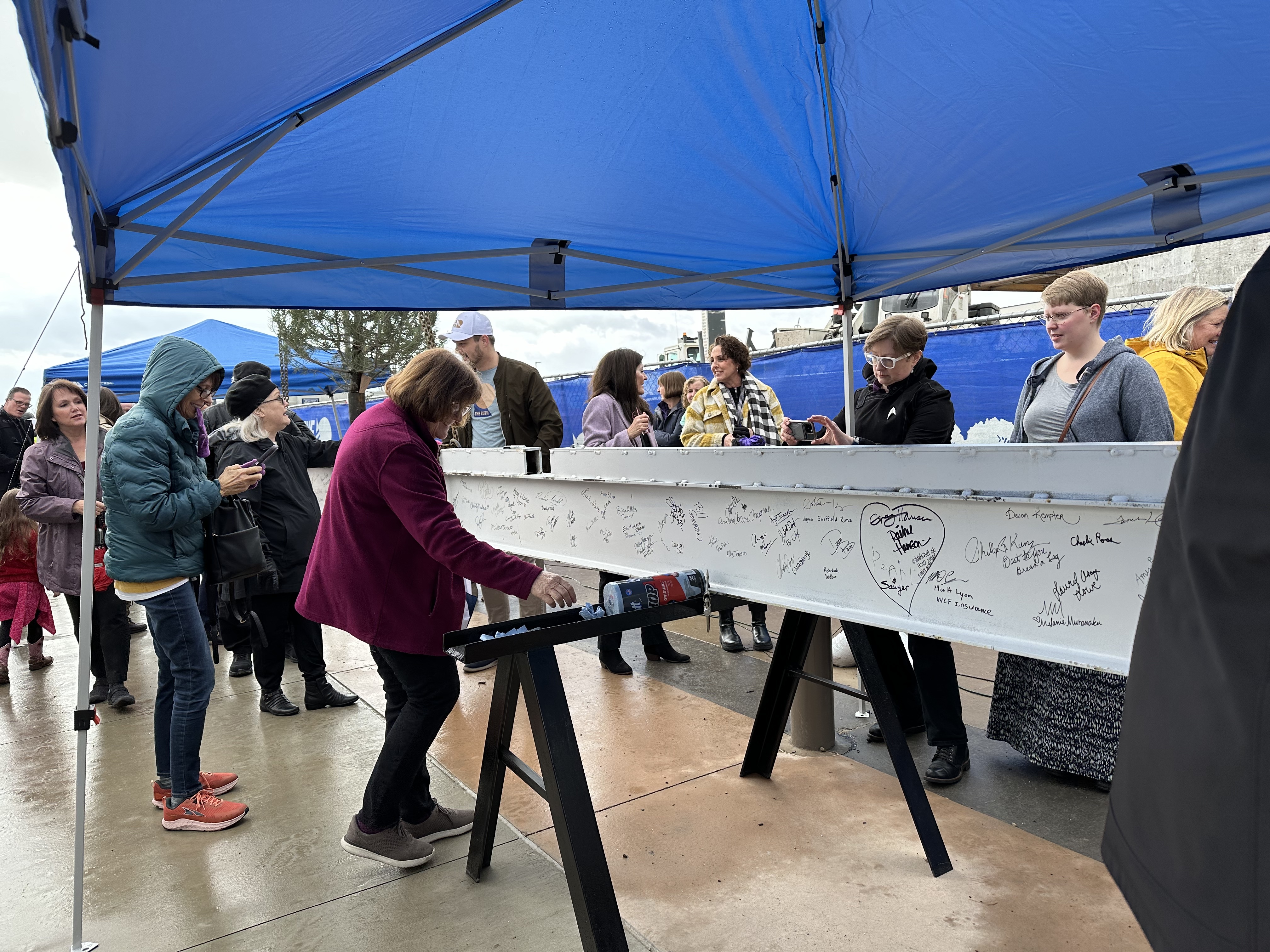 Actors, construction workers and appreciators of the theater signed a steel beam before it was raised into place during a beam-raising ceremony for the Ruth and Nathan Hale Theater in Pleasant Grove on Thursday.