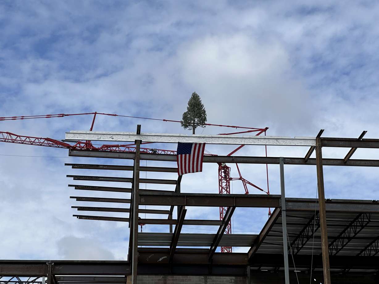 A final steel beam, decorated with signatures of actors, construction workers and staff, was placed during a beam-raising ceremony for the Ruth and Nathan Hale Theater in Pleasant Grove on Thursday.