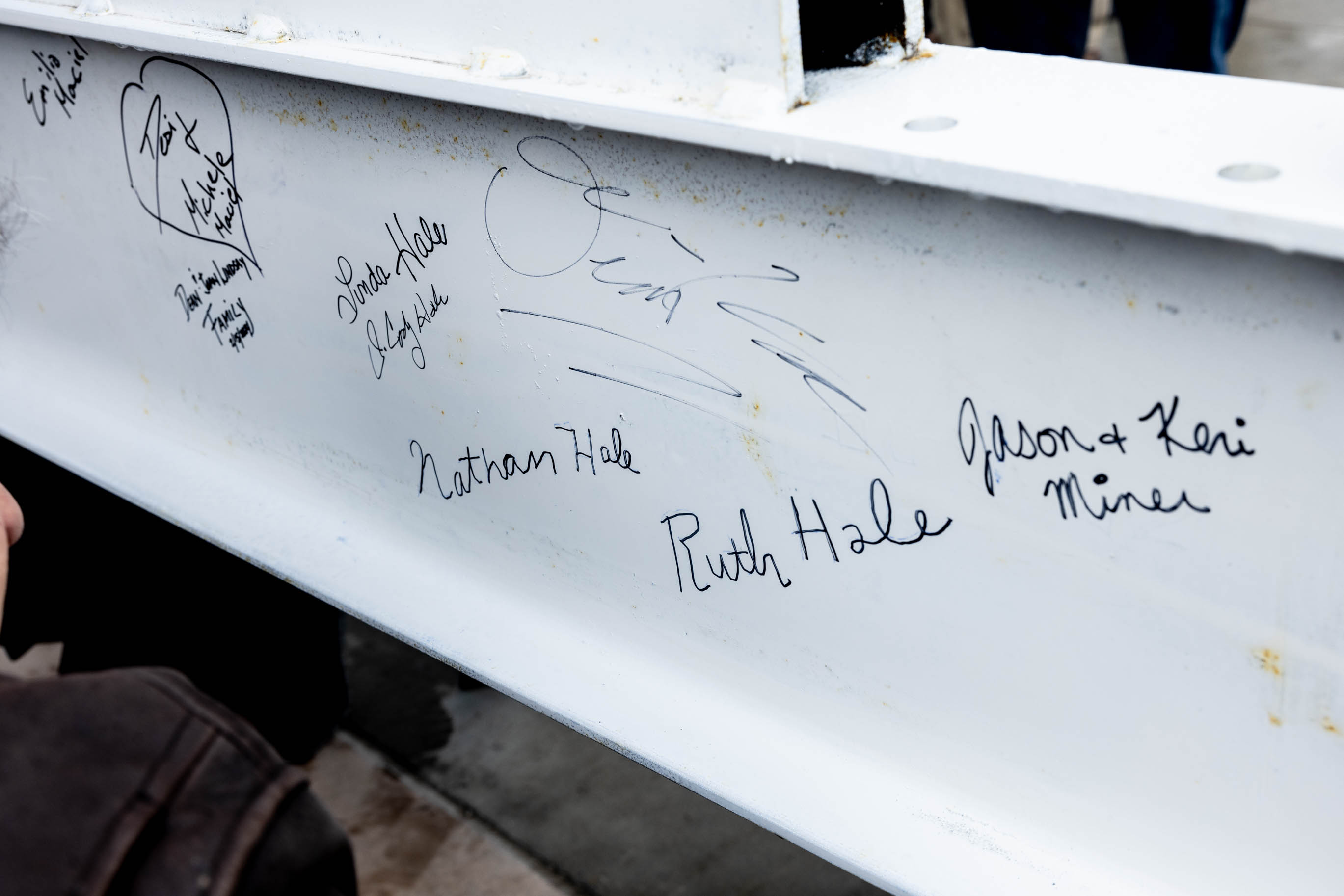 Dozens of actors, construction workers, city officials and more got to sign their names on a steel beam that was placed during a beam-raising ceremony for the Ruth and Nathan Hale Theater in Pleasant Grove on Thursday. Cody Hale, son of the founders, traced his parents' signatures onto the beam that became part of the theater named in honor of them.
