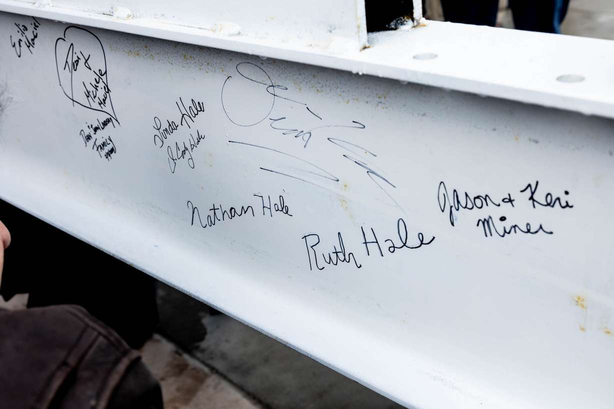Dozens of actors, construction workers, city officials and more got to sign their names on a steel beam that was placed during a beam-raising ceremony for the Ruth and Nathan Hale Theater in Pleasant Grove on Thursday. Cody Hale, son of the founders, traced his parents' signatures onto the beam that became part of the theater named in honor of them.