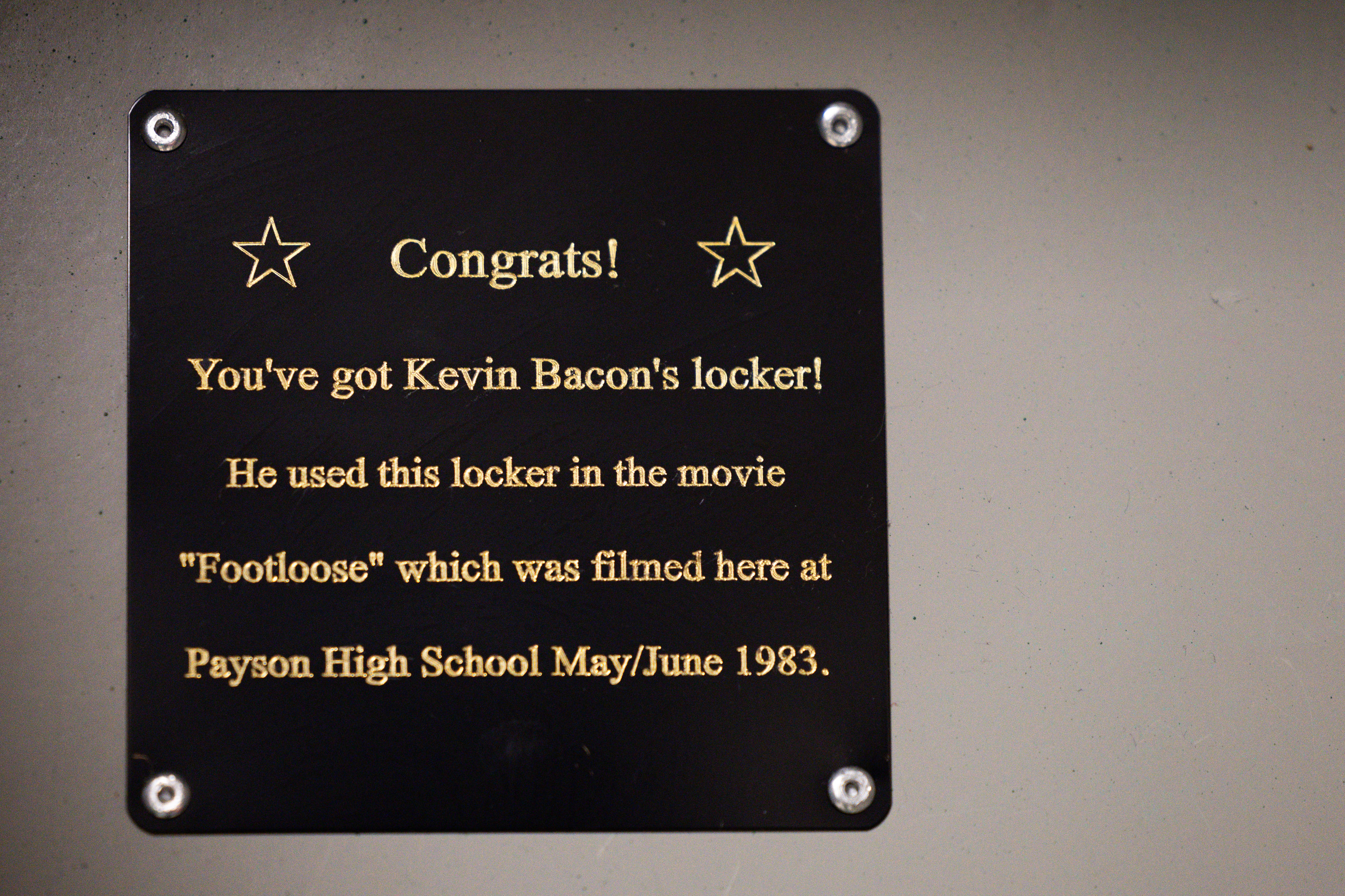 A sign inside actor Kevin Bacon’s character Ren McCormack’s locker from the film “Footlose” is pictured at Payson High School in Payson on Wednesday. The locker has now been memorialized and students are trying to get Bacon to come to their prom as part of the 40th anniversary of the film, which filmed many of the scenes at the school.