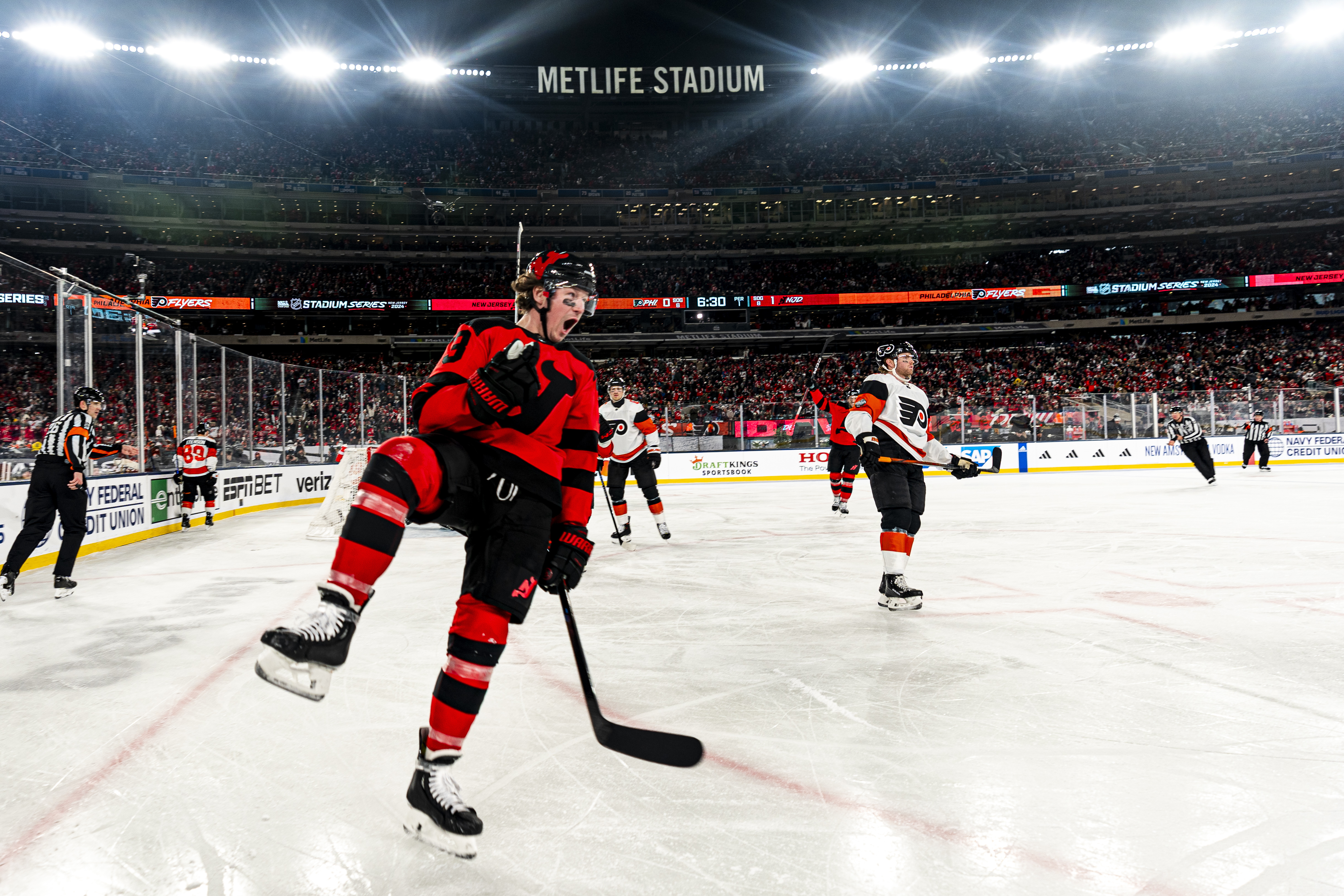 New Jersey Devils right wing Tyler Toffoli (73) celebrates after scoring against the Philadelphia Flyers in the first period of an NHL Winter Classic hockey game in East Rutherford, N.J., Saturday, Feb. 17, 2024.