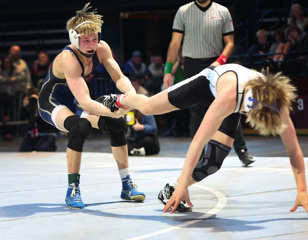 Syracuse's Mason Carlson, left, competes with Layton's Lander Bosh at 120 lbs. in the 6A boys wrestling state championships at UVU in Orem on Saturday, Feb. 17, 2024.