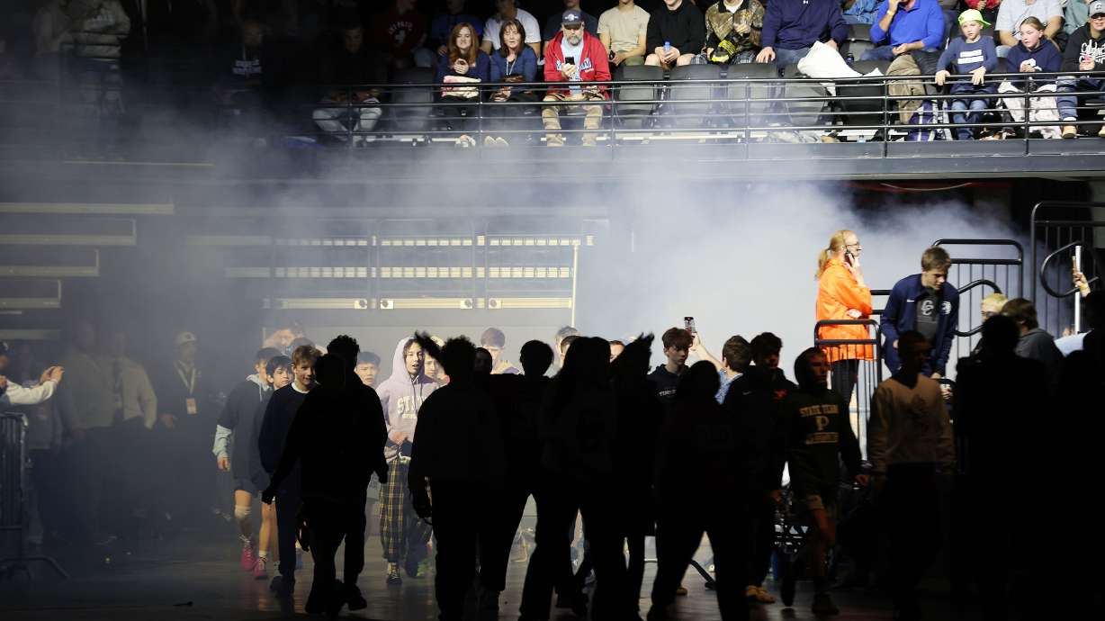 Wrestlers are introduced for state championships at UVU in Orem on Saturday, Feb. 17, 2024.