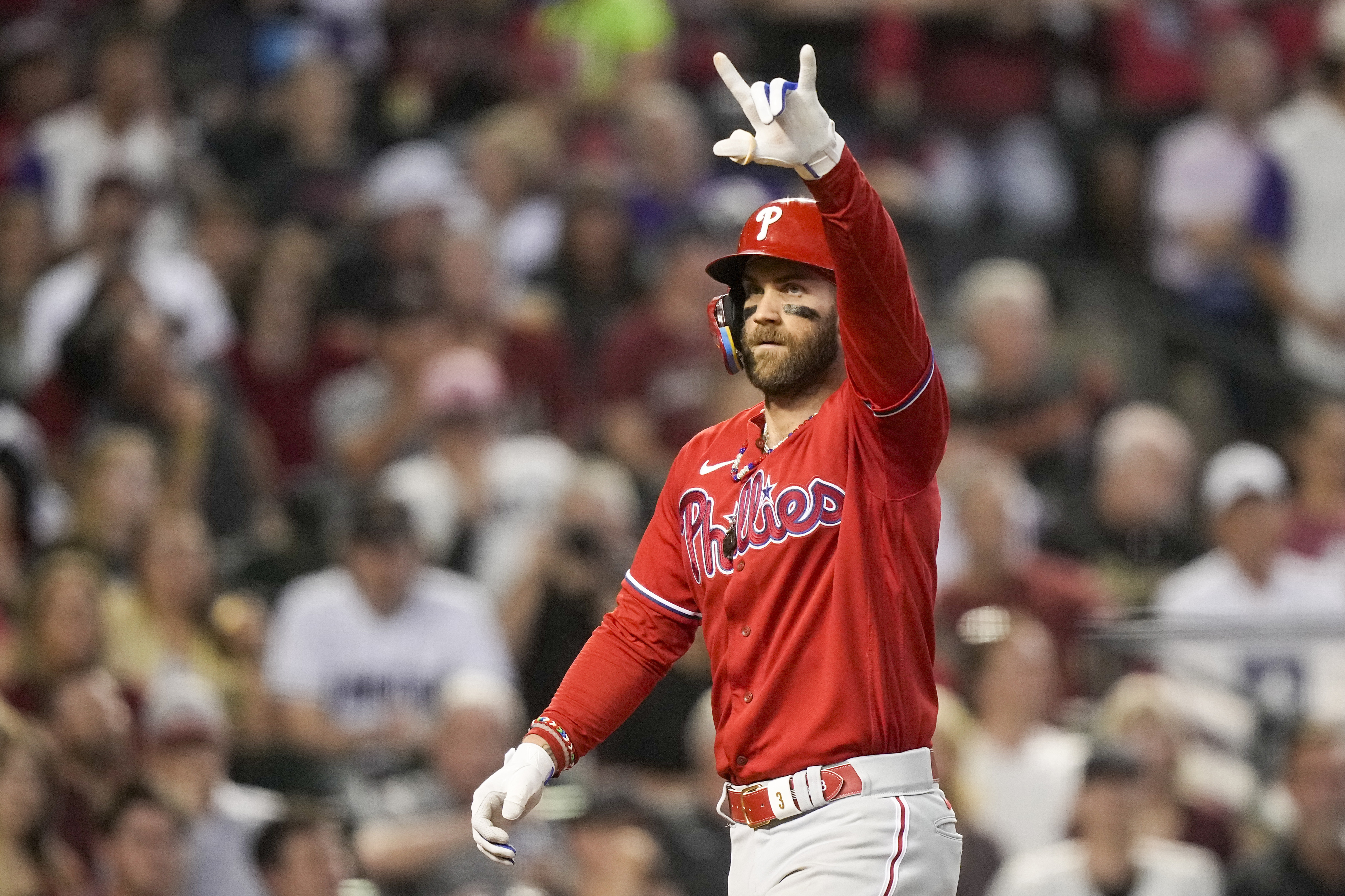 FILE - Philadelphia Phillies' Bryce Harper celebrates a home run against the Arizona Diamondbacks during the sixth inning in Game 5 of the baseball NL Championship Series in Phoenix, Saturday, Oct. 21, 2023. Harper said Sunday, Feb. 18, 2024, that he wants to finish his career with the Philadelphia Phillies, playing into his 40s. 