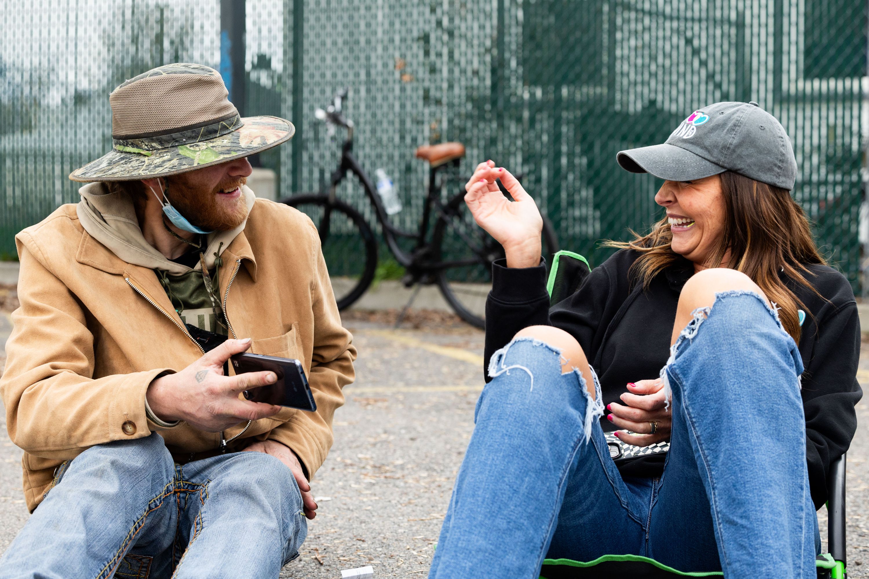 Jessica Lowe, founder of Be a Little Too Kind, laughs with Cameron McCormack, one of her homies, in Salt Lake City on Feb. 1. Be a Little Too Kind is a nonprofit organization focused on assisting those experiencing homelessness by providing a homemade meal every week and other essential life-sustaining items.