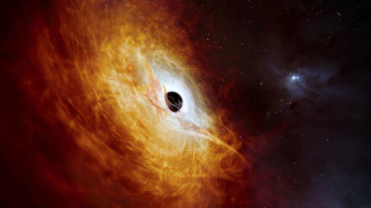 This illustration provided by the European Southern Observatory in February, depicts the record-breaking quasar J059-4351, the bright core of a distant galaxy that is powered by a supermassive black hole.