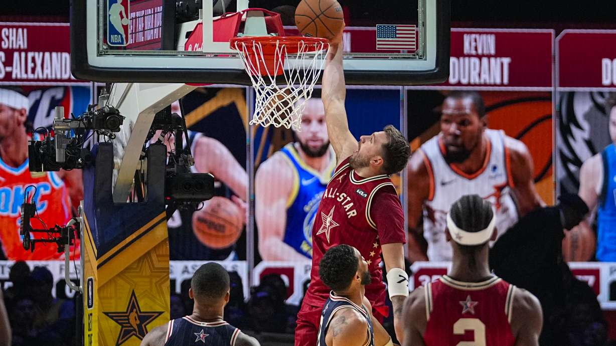 Dallas Mavericks guard Luka Doncic (77) get a basket on a dunk during the second half of an NBA All-Star basketball game in Indianapolis, Sunday, Feb. 18, 2024.