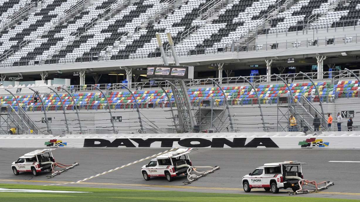 Dryers drive through the tri-oval before a practice session for the NASCAR Daytona 500 auto race Saturday, Feb. 17, 2024, at Daytona International Speedway in Daytona Beach, Fla. Rain is forecast for today's Xfinity race and Sunday's running of the Daytona 500.