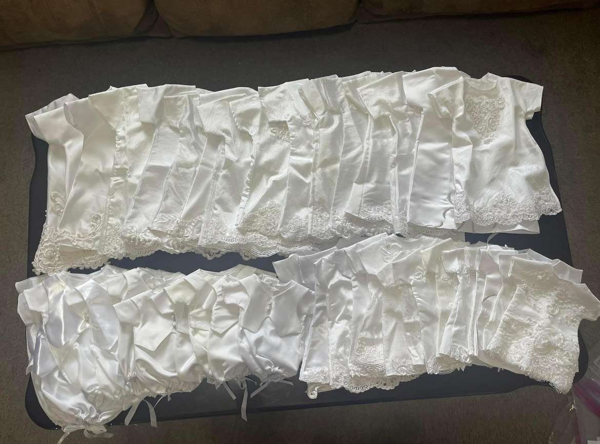 Infant burial clothing created by Michaun Torgersen from donated wedding dresses.
