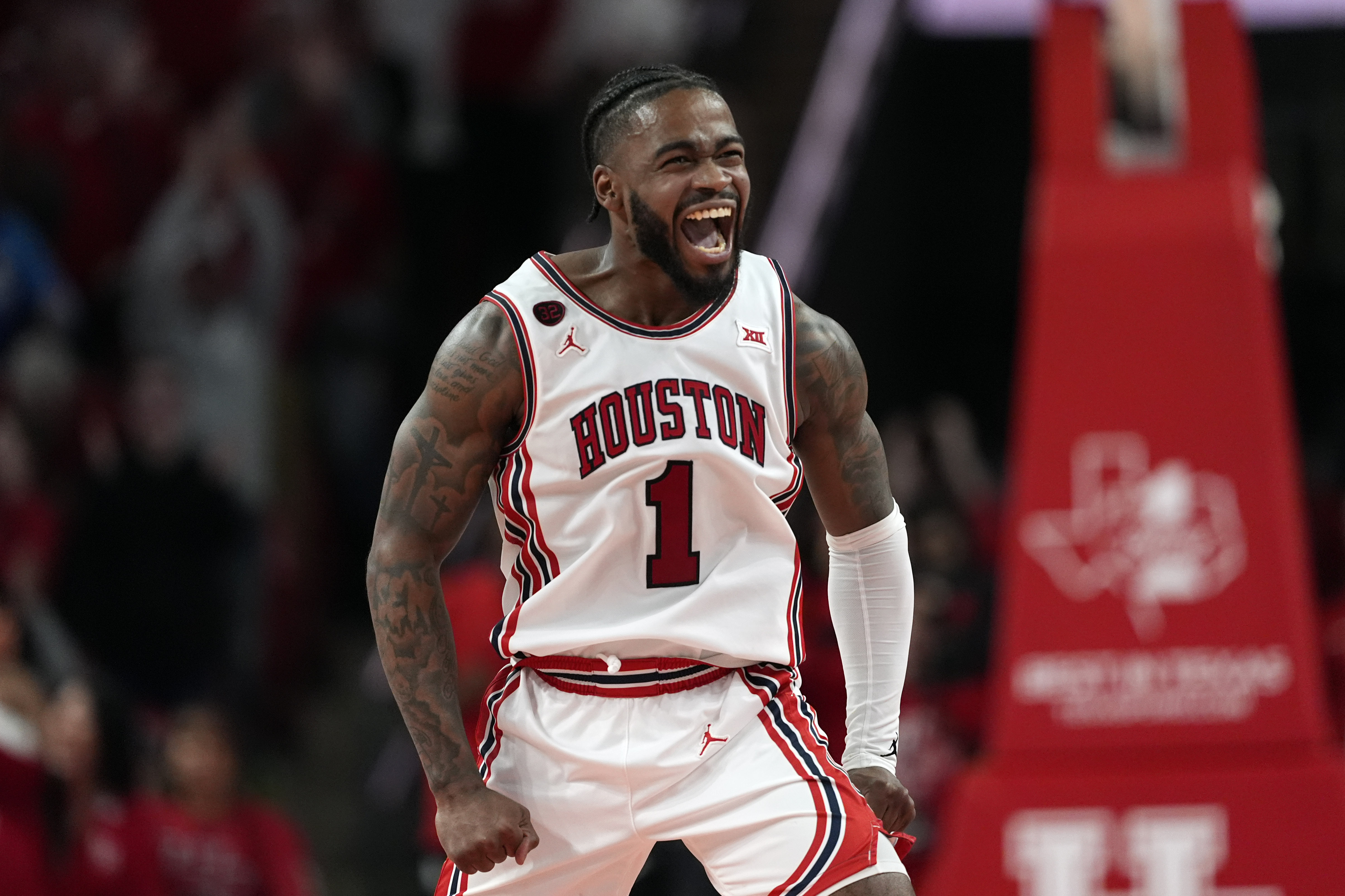Houston's Jamal Shead (1) celebrates during the second half of an NCAA college basketball game against Iowa State Monday, Feb. 19, 2024, in Houston. Houston won 73-65. 