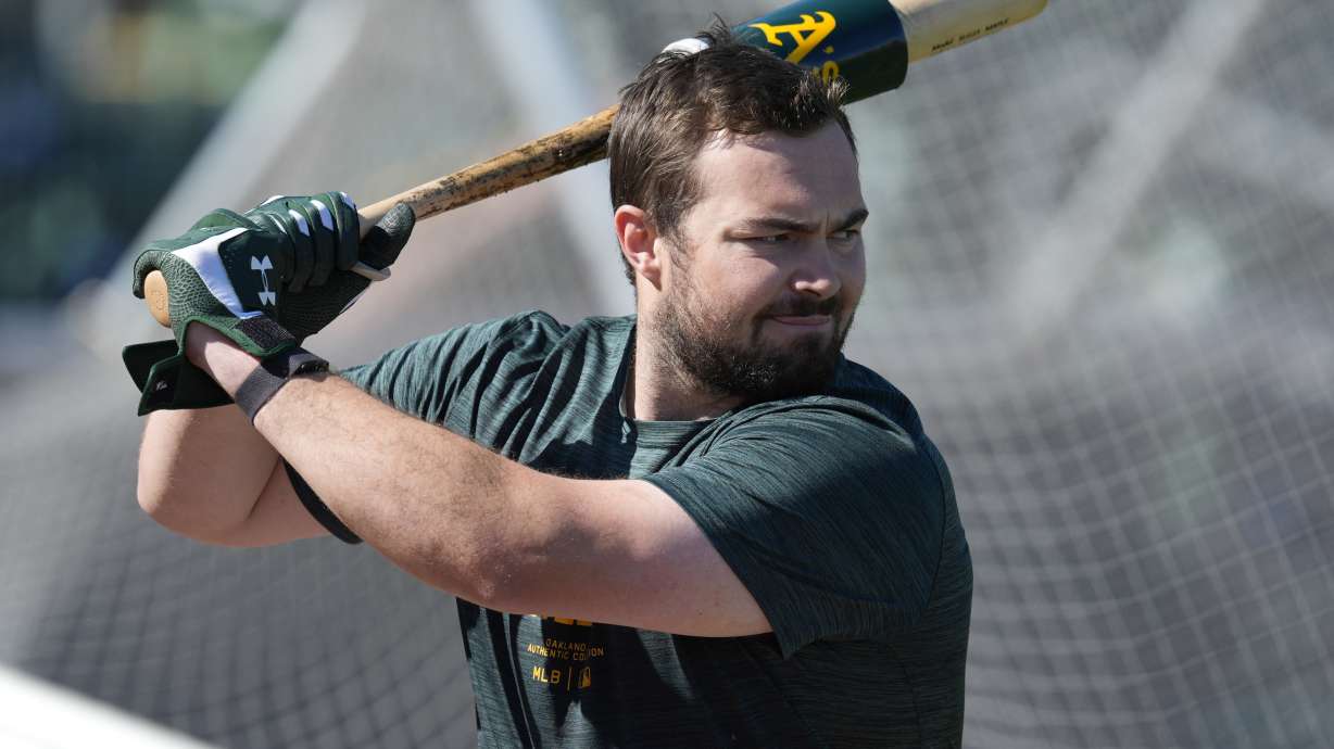 Oakland Athletics catcher Shea Langeliers hits during a baseball spring training workout, Friday, Feb. 16, 2024, in Mesa, Ariz.