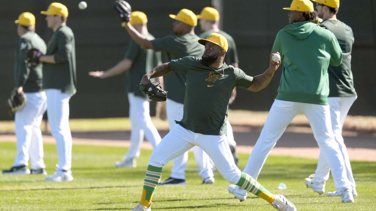 Oakland Athletics players warm up during a baseball spring training workout on Feb. 16, 2024. The team is still searching for a temporary home between 2025 and 2027, which could be in Utah.