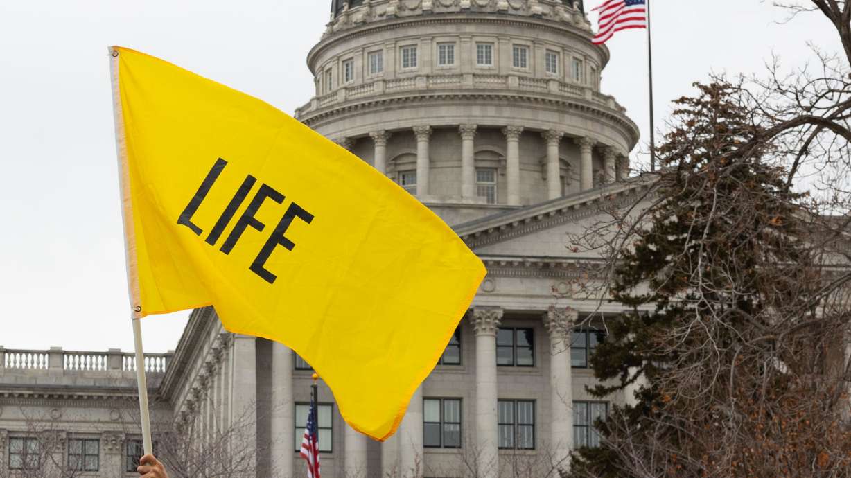 A flag that reads “Life” at March for Life Utah at the Capitol in Salt Lake City on Jan. 20. A bill aiming to "simplify" legal questions surrounding Utah's trigger abortion ban was approved by the House Judiciary Committee on Tuesday.