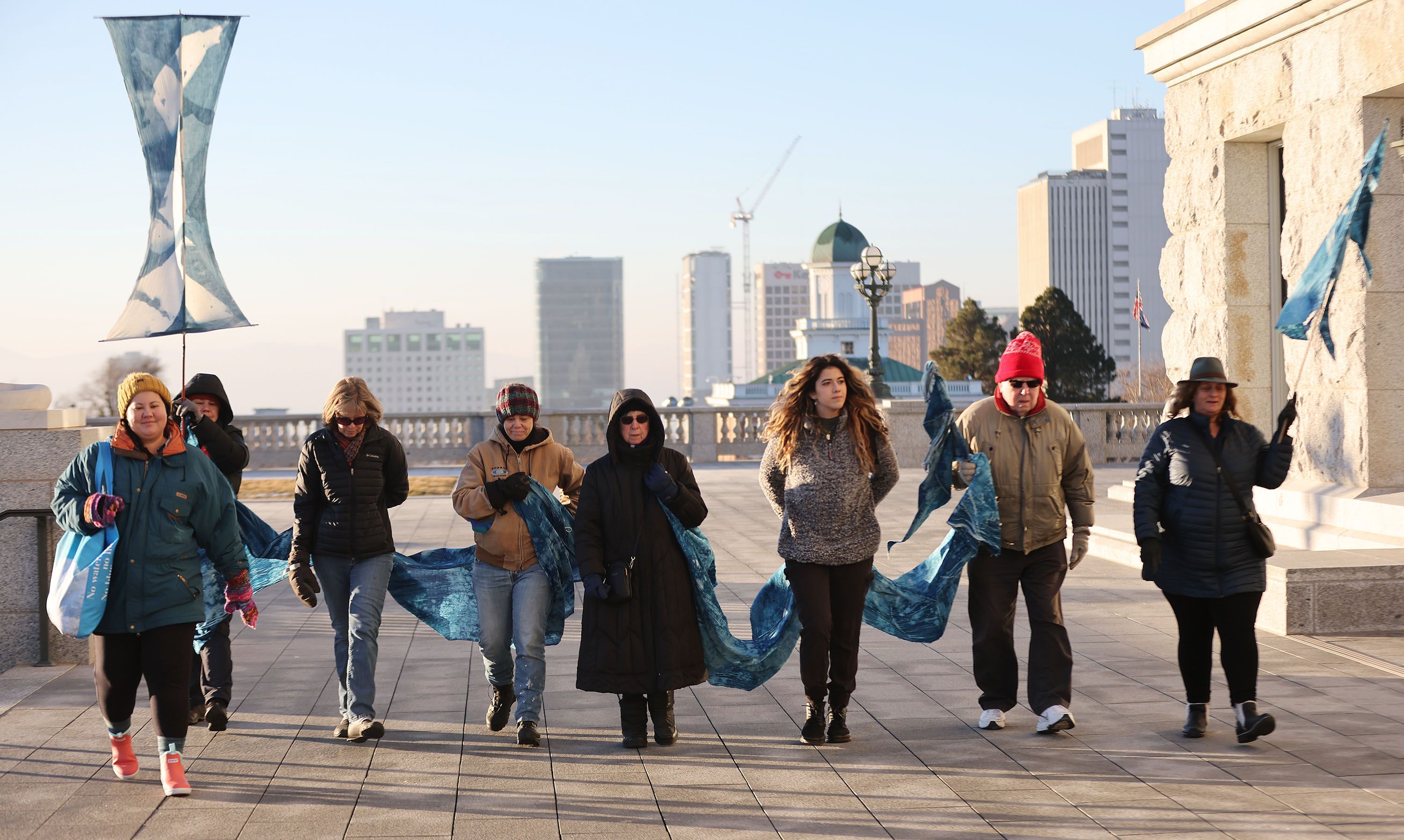 Members of the Great Salt Lake vigil group walk the grounds of the Capitol in Salt Lake City on Jan. 30. The group walks around the grounds every morning as part of its vigil.