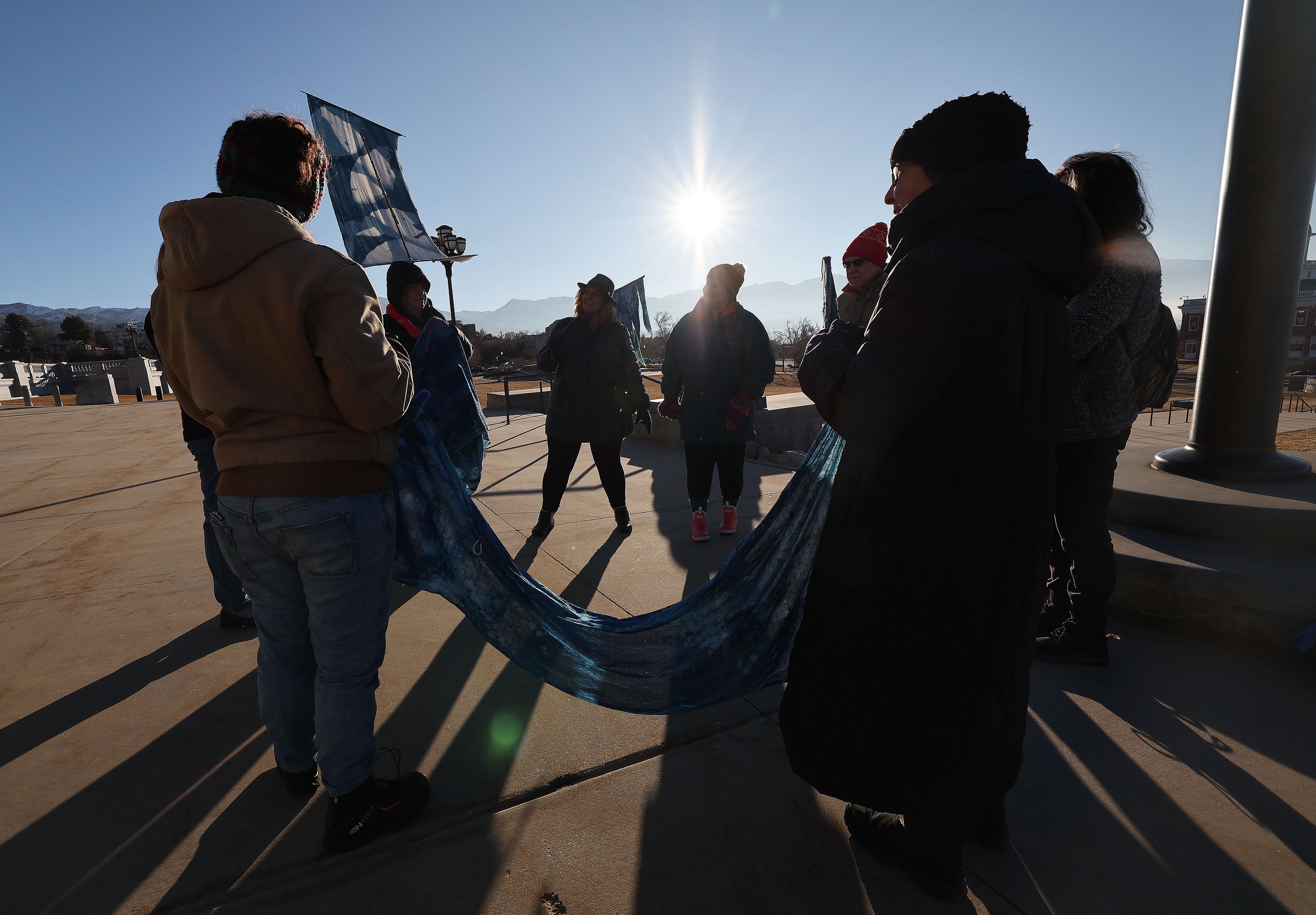 Members of the Great Salt Lake vigil group pause and talk while walking the grounds of the Capitol in Salt Lake City on Jan. 30. The group walks around the grounds every morning as part of its vigil.