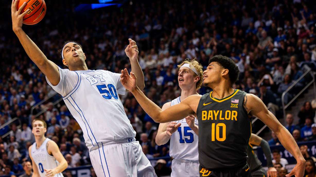 Brigham Young center Aly Khalifa (50) grabs a rebound during a men’s college basketball game between Brigham Young University and Baylor University at the Marriott Center in Provo on Tuesday, Feb. 20, 2024.